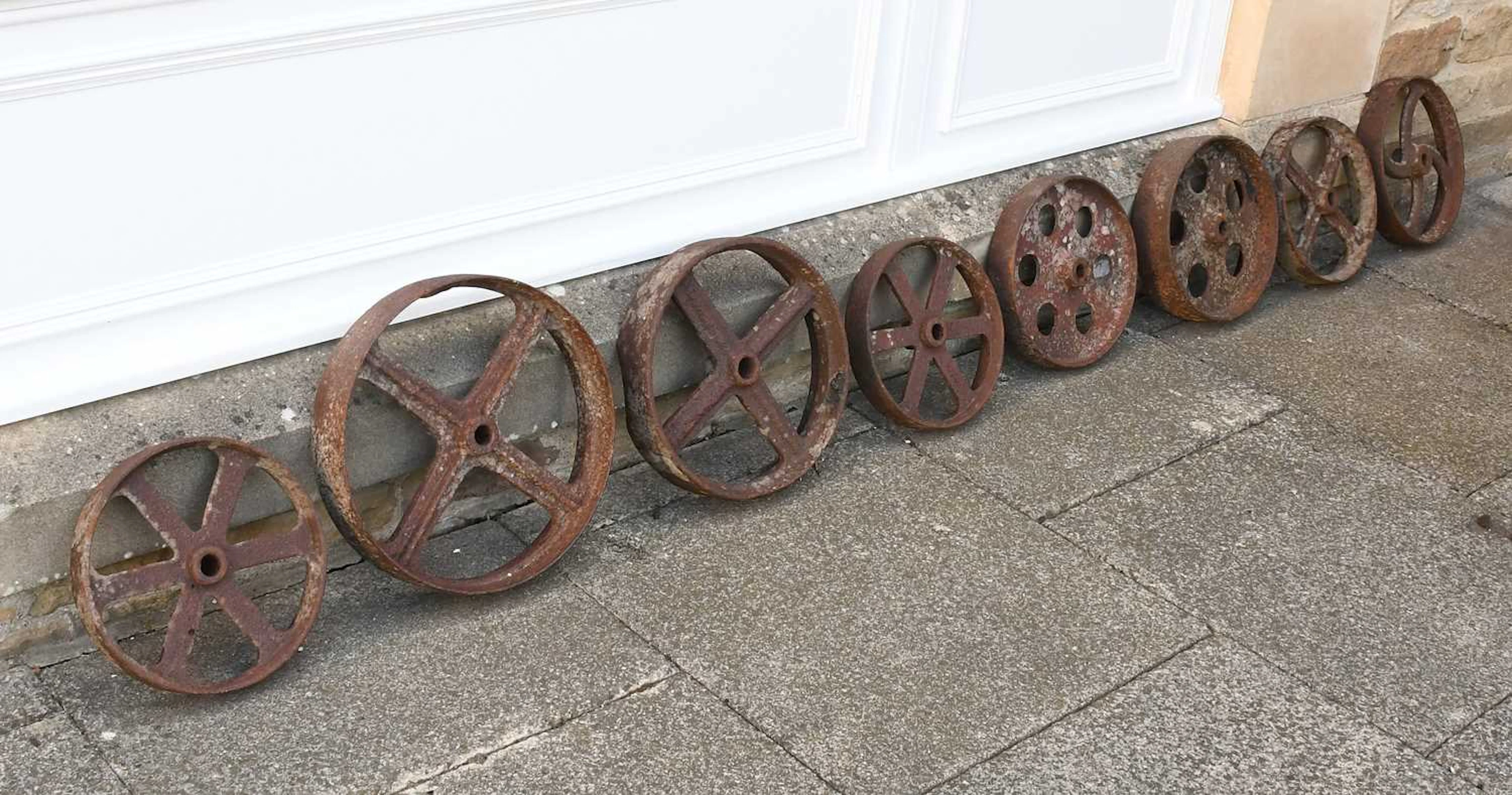 Eight Various Cast Iron Wheels