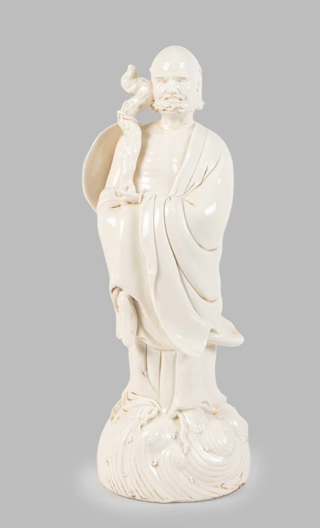 A Blanc de Chine Standing Figure of the Immortal Li Tieguai, Qing Dynasty