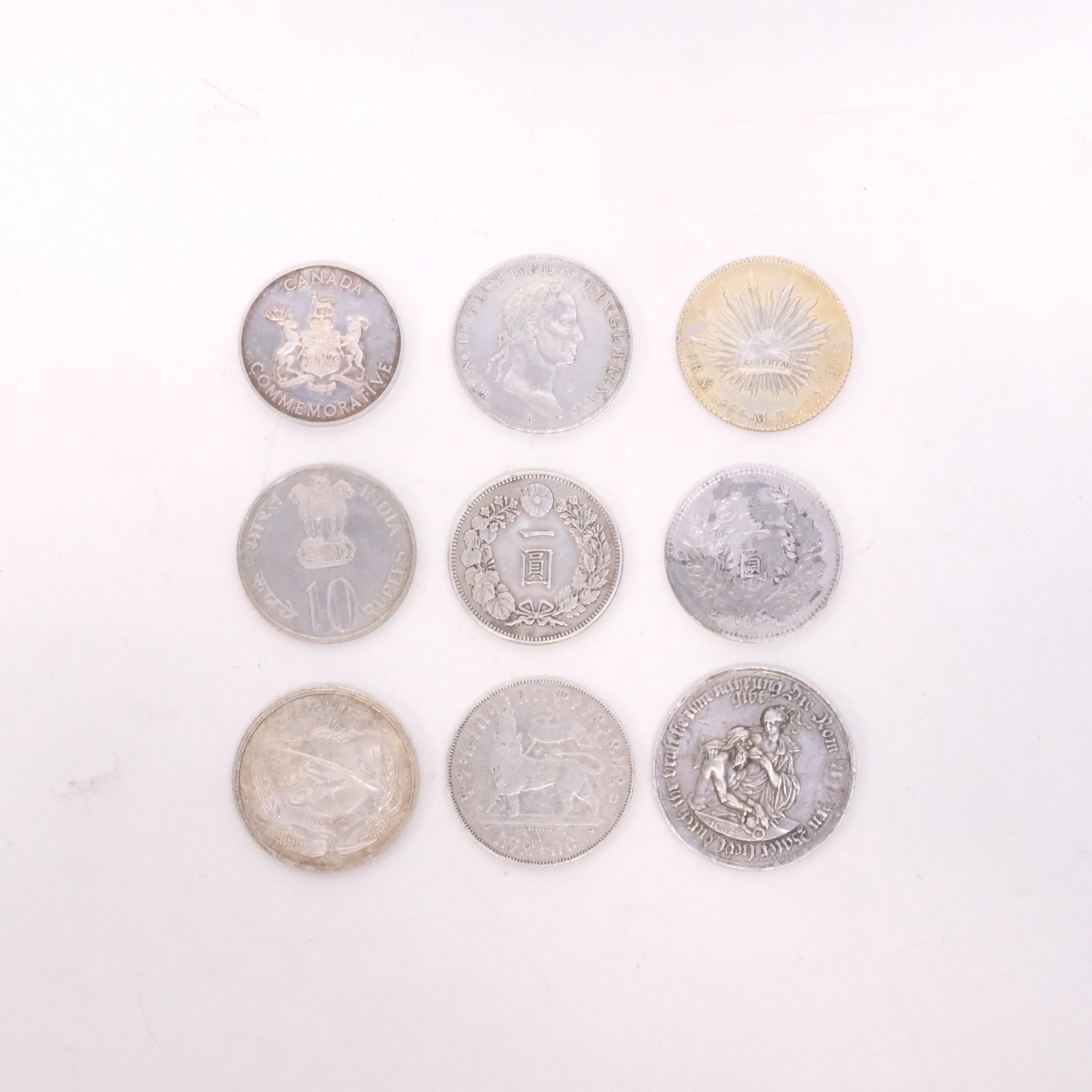 MINNESMYNT, DELVIS SILVER, NIO STYCKEN.