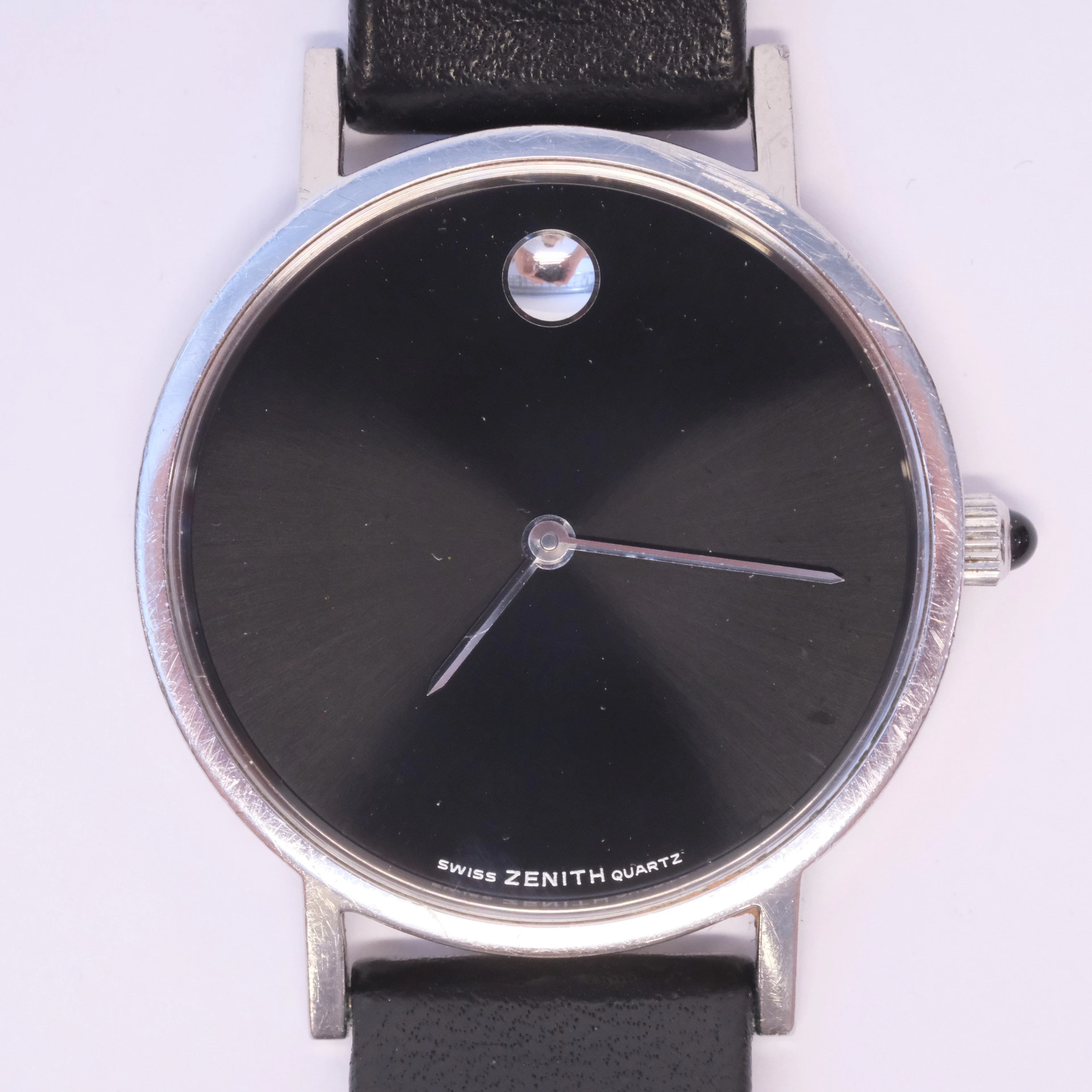 MOVADO & ZENITH. ARMMBANDSUR, "THE MUSEUM WATCH". QUARTZ. 1980/90-TAL.