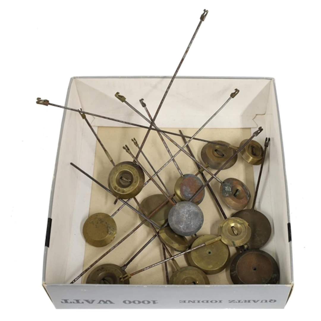 Collection of clock pendulums, mostly for French mantel cloc...