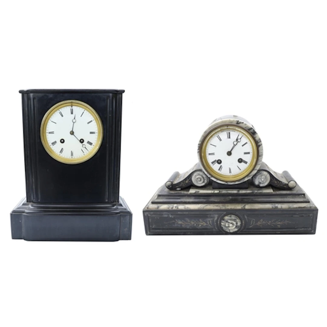 Two black slate mantel clocks to include a drumhead example,...