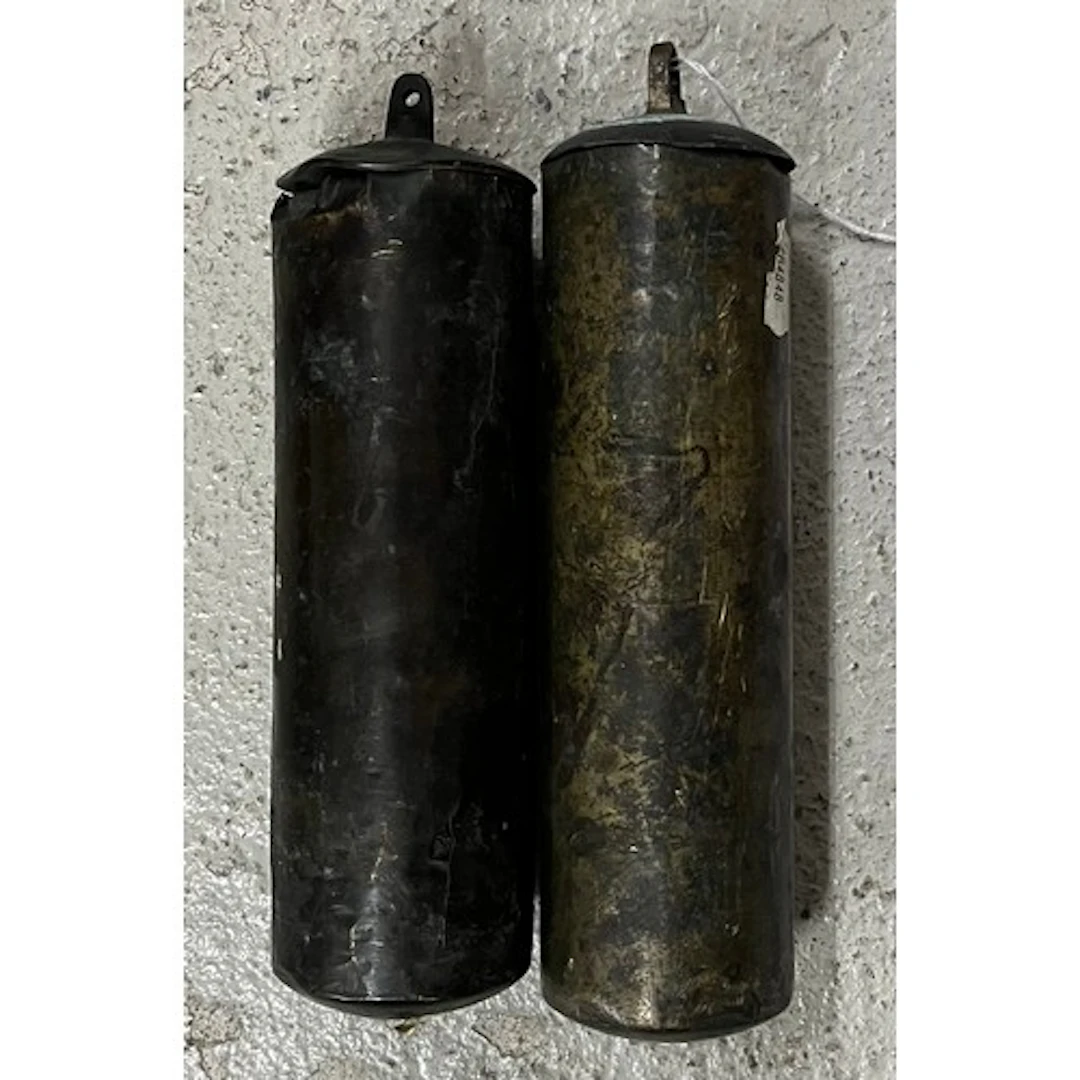Pair of of brass capped longcase clock weights with slightly...