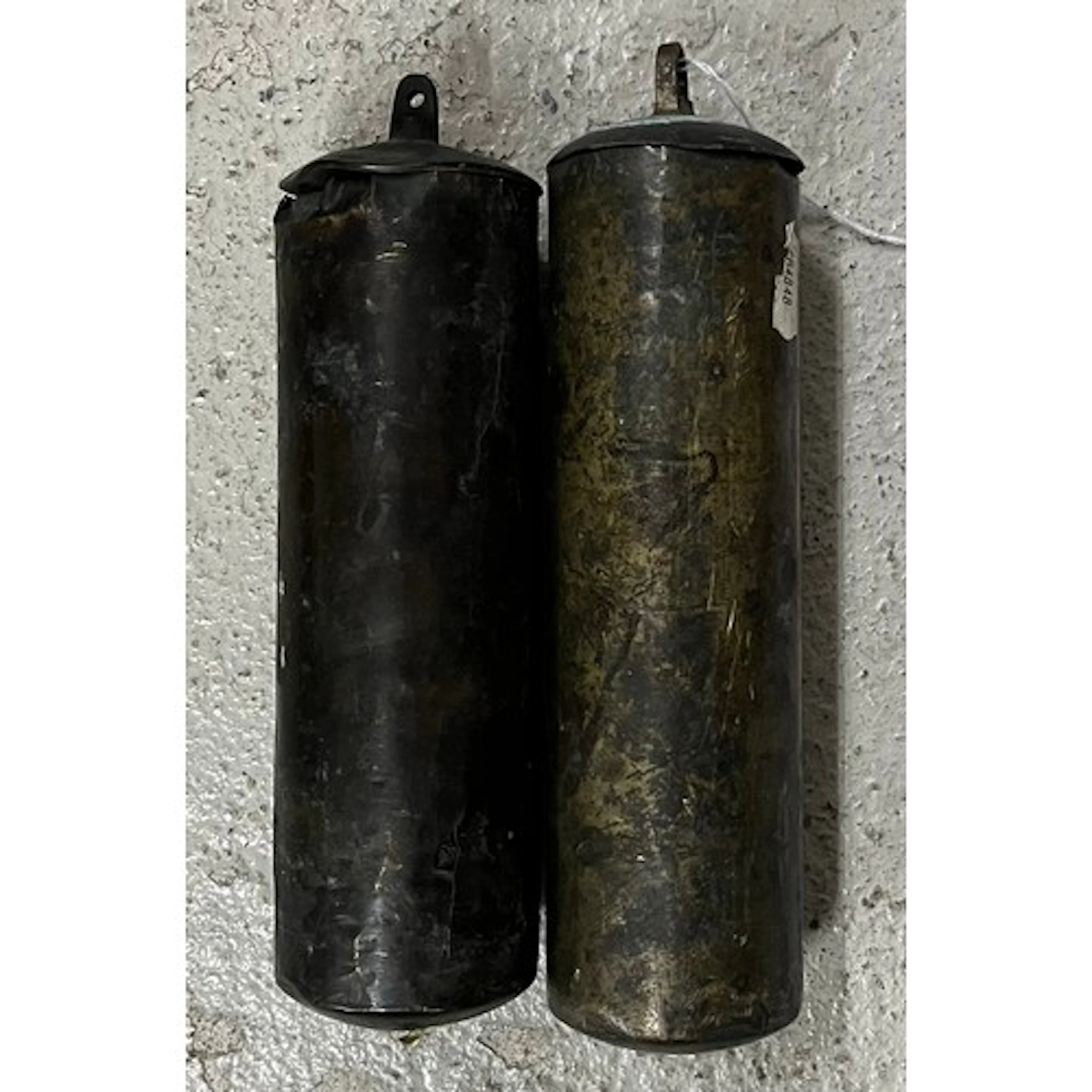 Pair of of brass capped longcase clock weights with slightly...