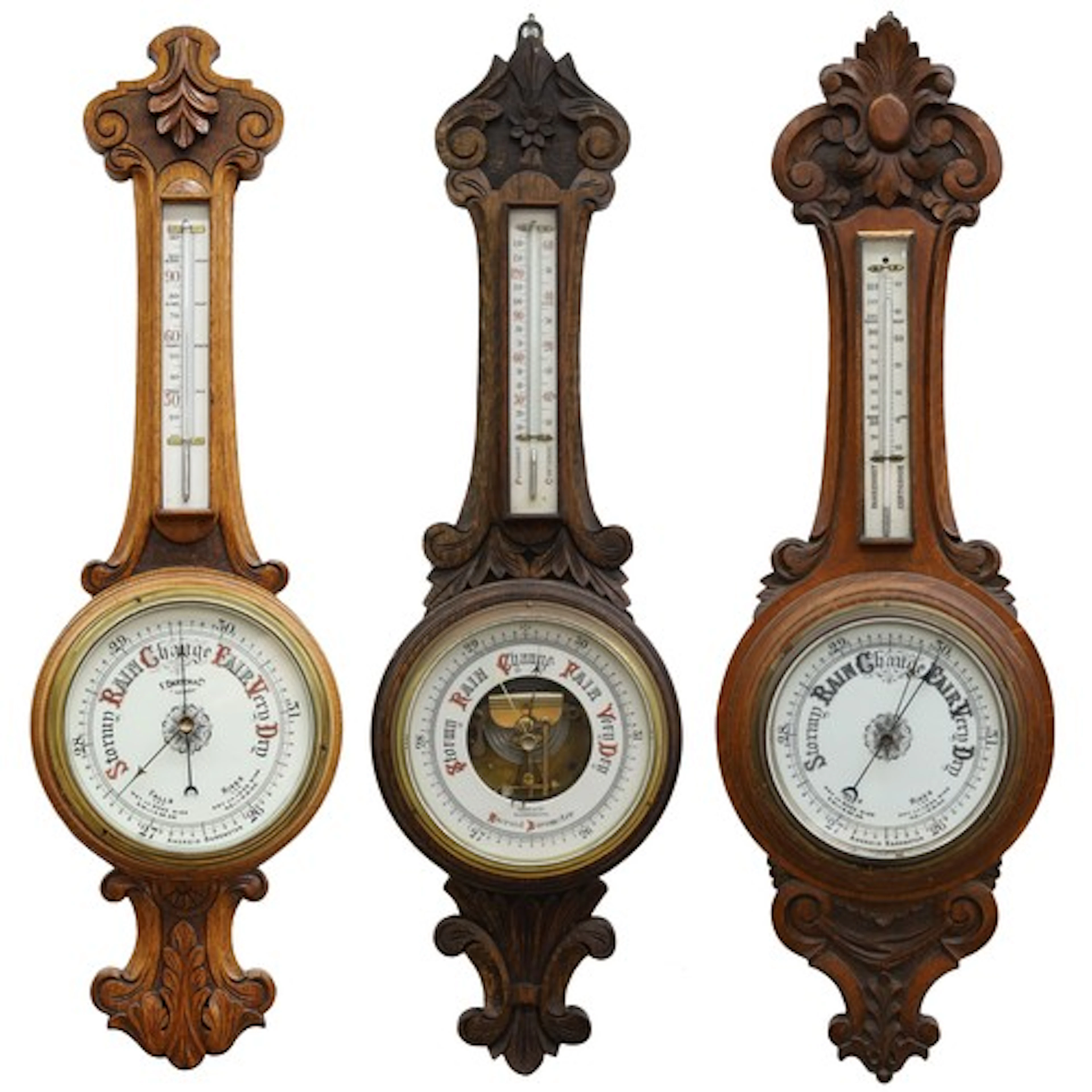Group of three oak aneroid barometers, each with circular po...