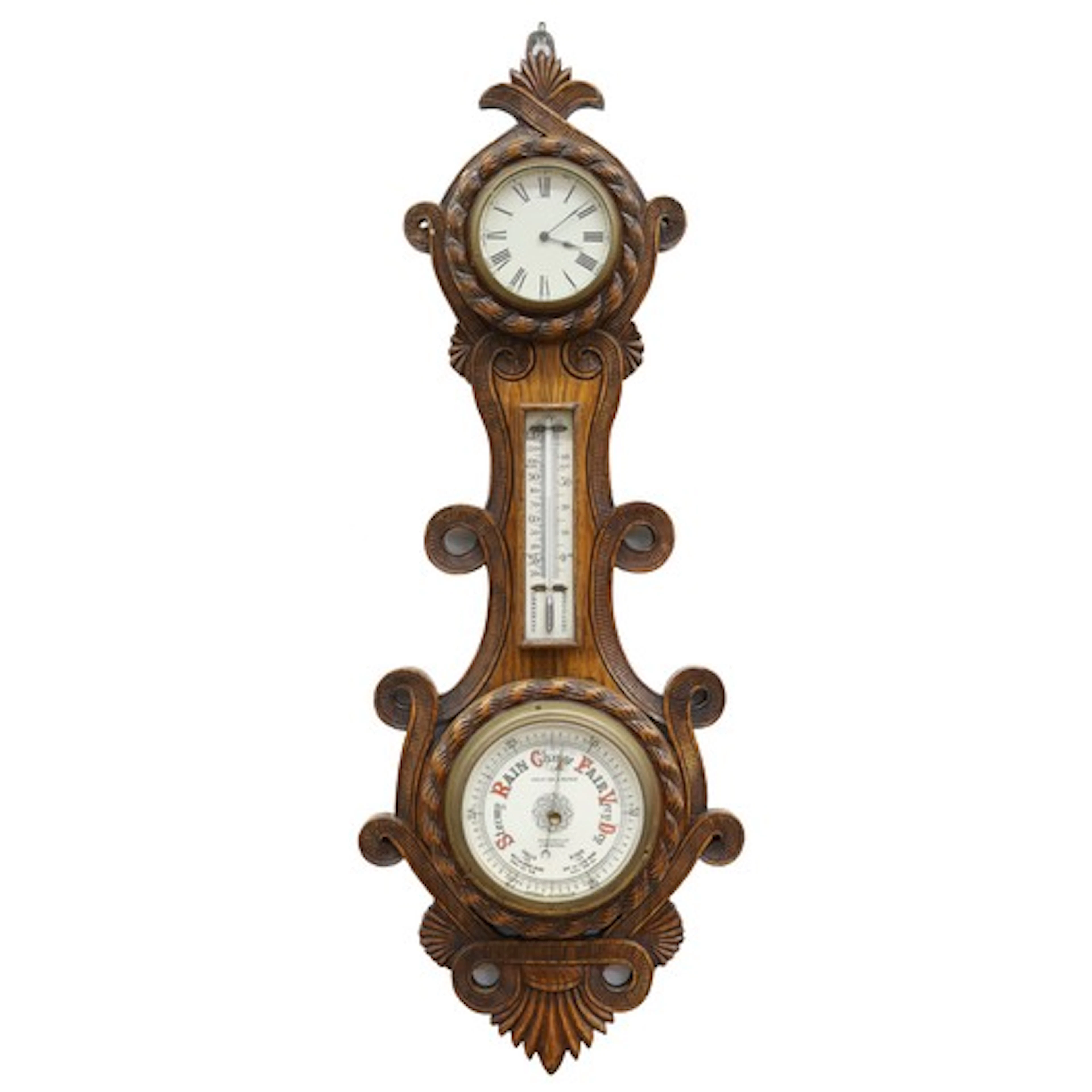 Carved oak aneroid barometer and clock, the circular pottery...