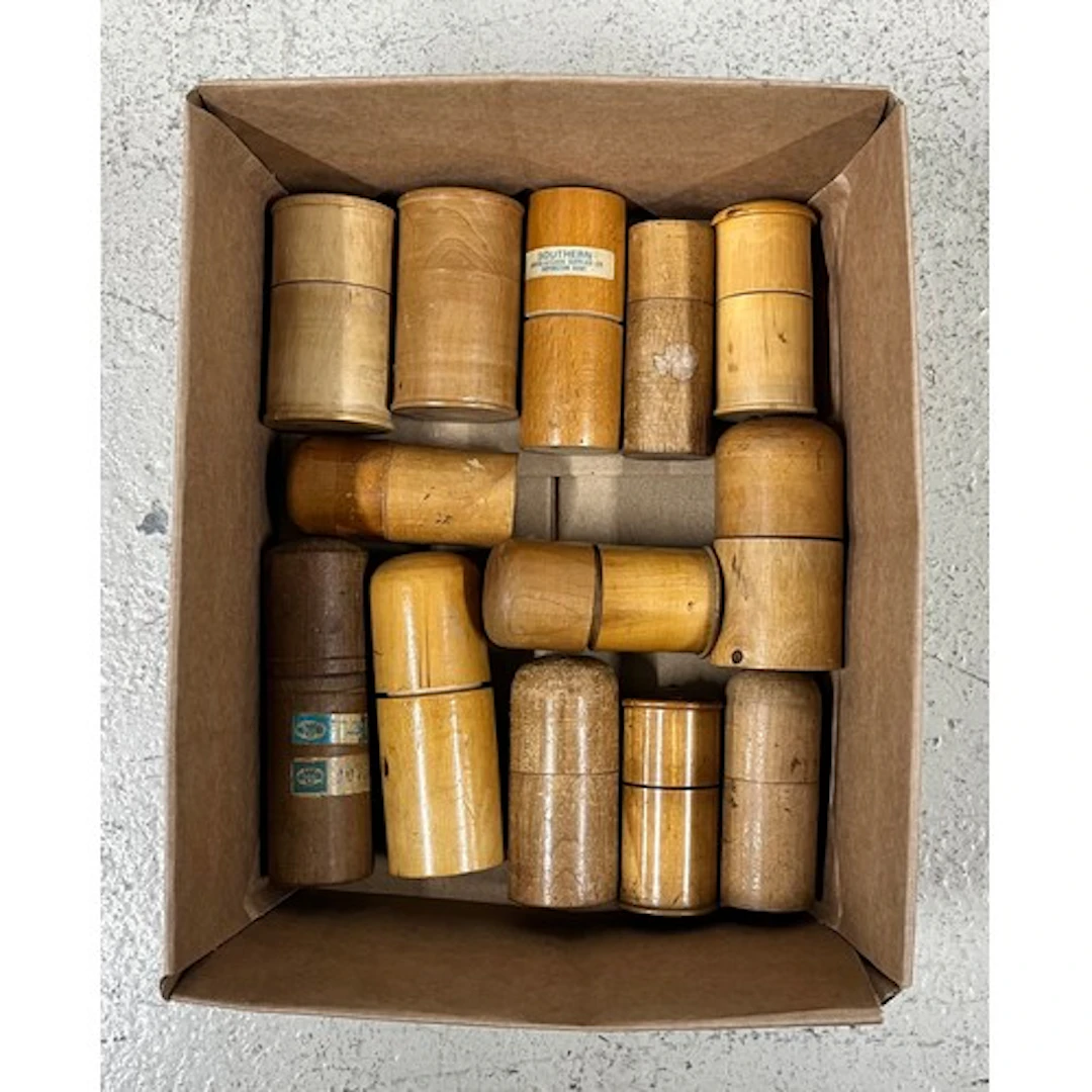 Thirteen wooden containers containing sets of staking tools,...