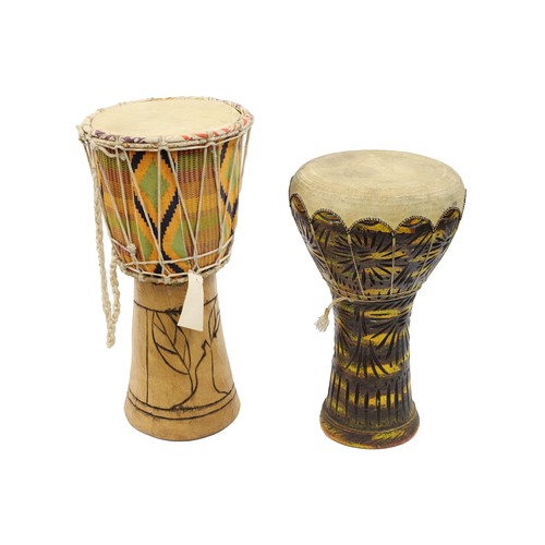 Two djembe drums, one made of clay and one made of wood (2)...