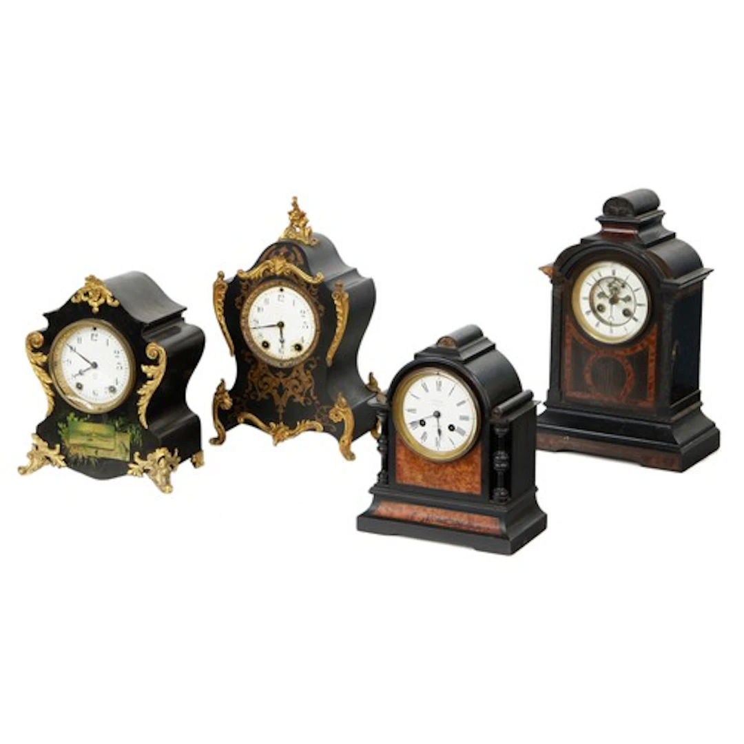 Four 19th century ebonised wooden two train mantel clocks, t...