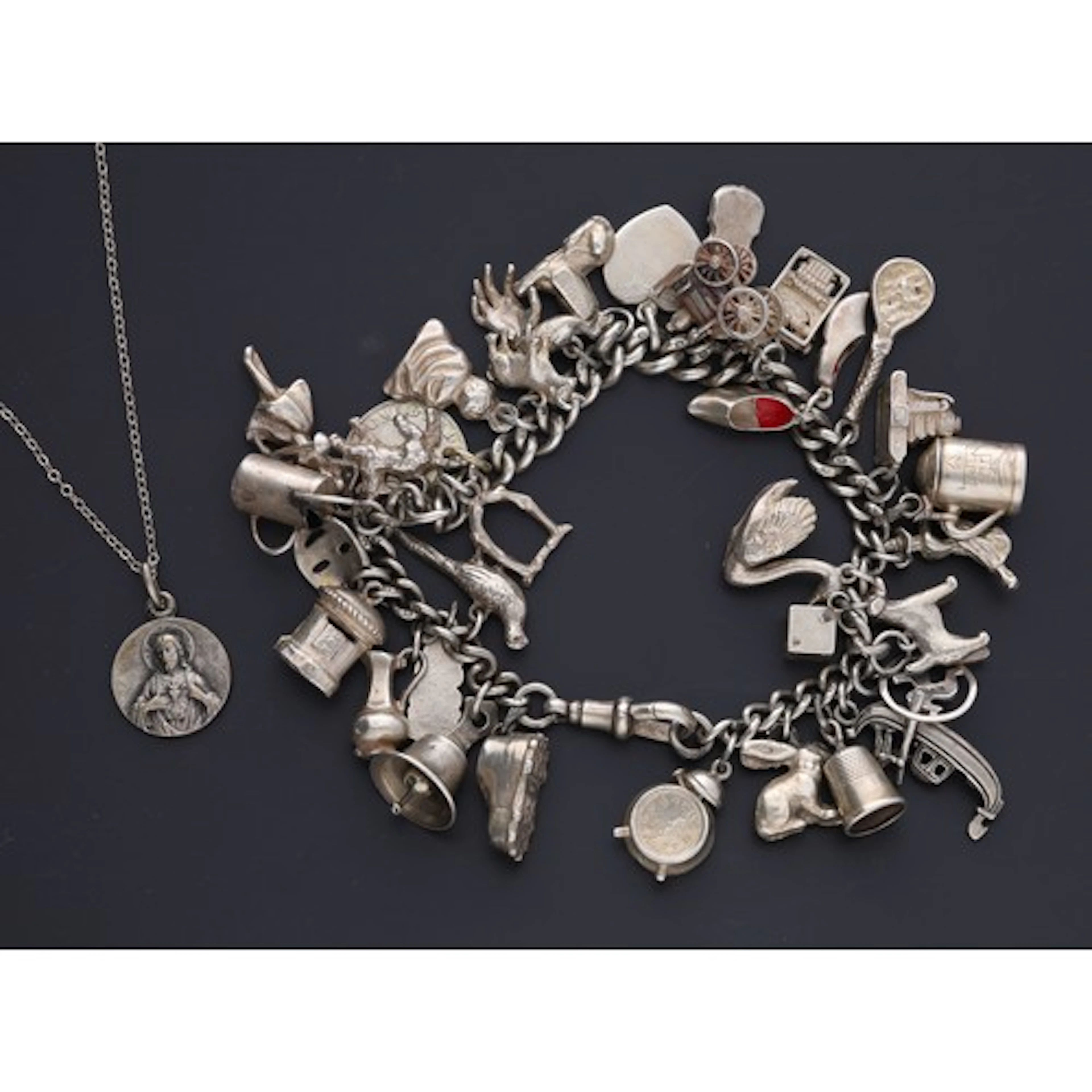 Heavy silver charm bracelet, 99.7gm; together with a pendant...