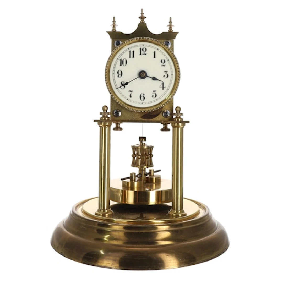 German brass torsion mantel clock, the 2.75" cream dial over...