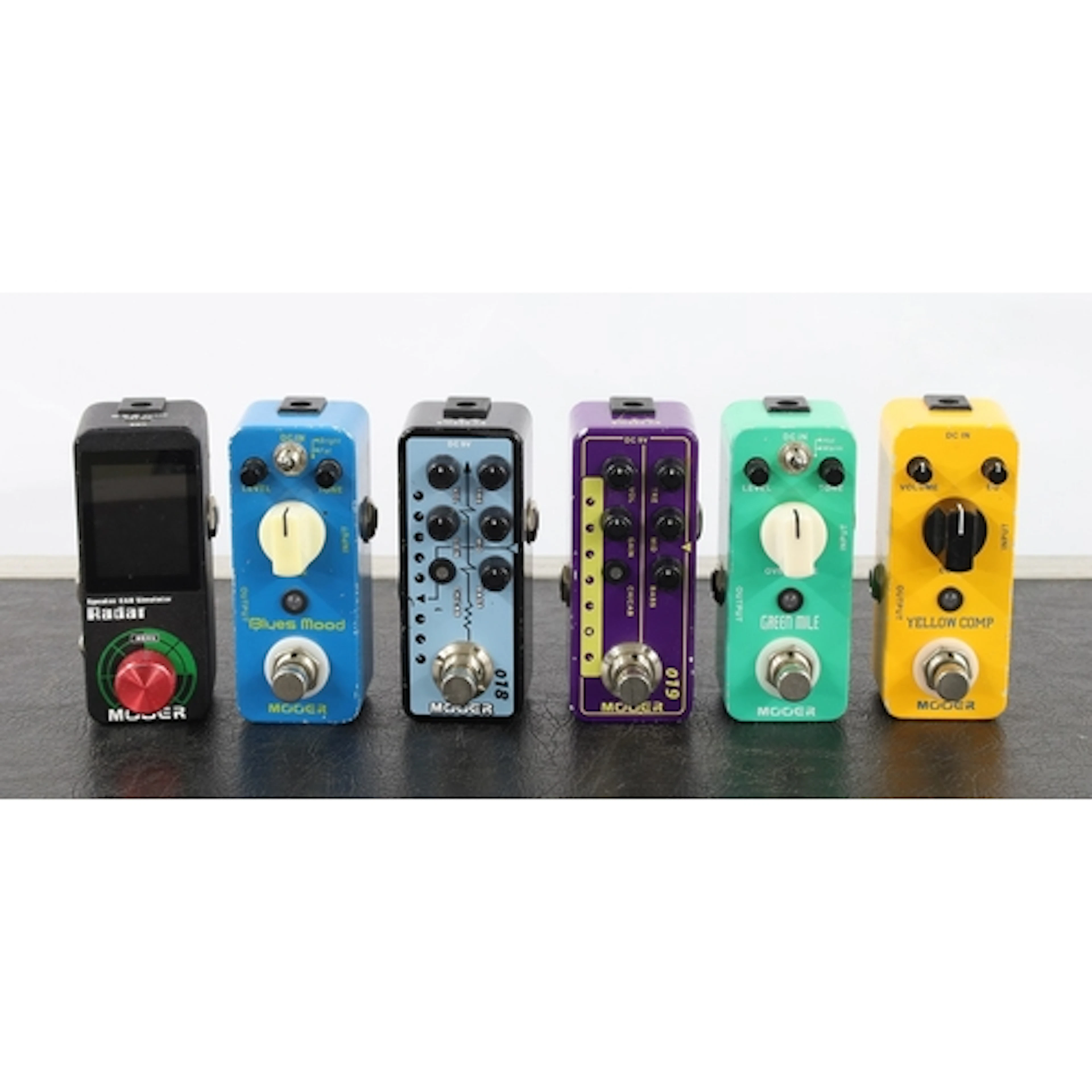Six Mooer mini guitar pedals to include a Custom 100, a Rada...