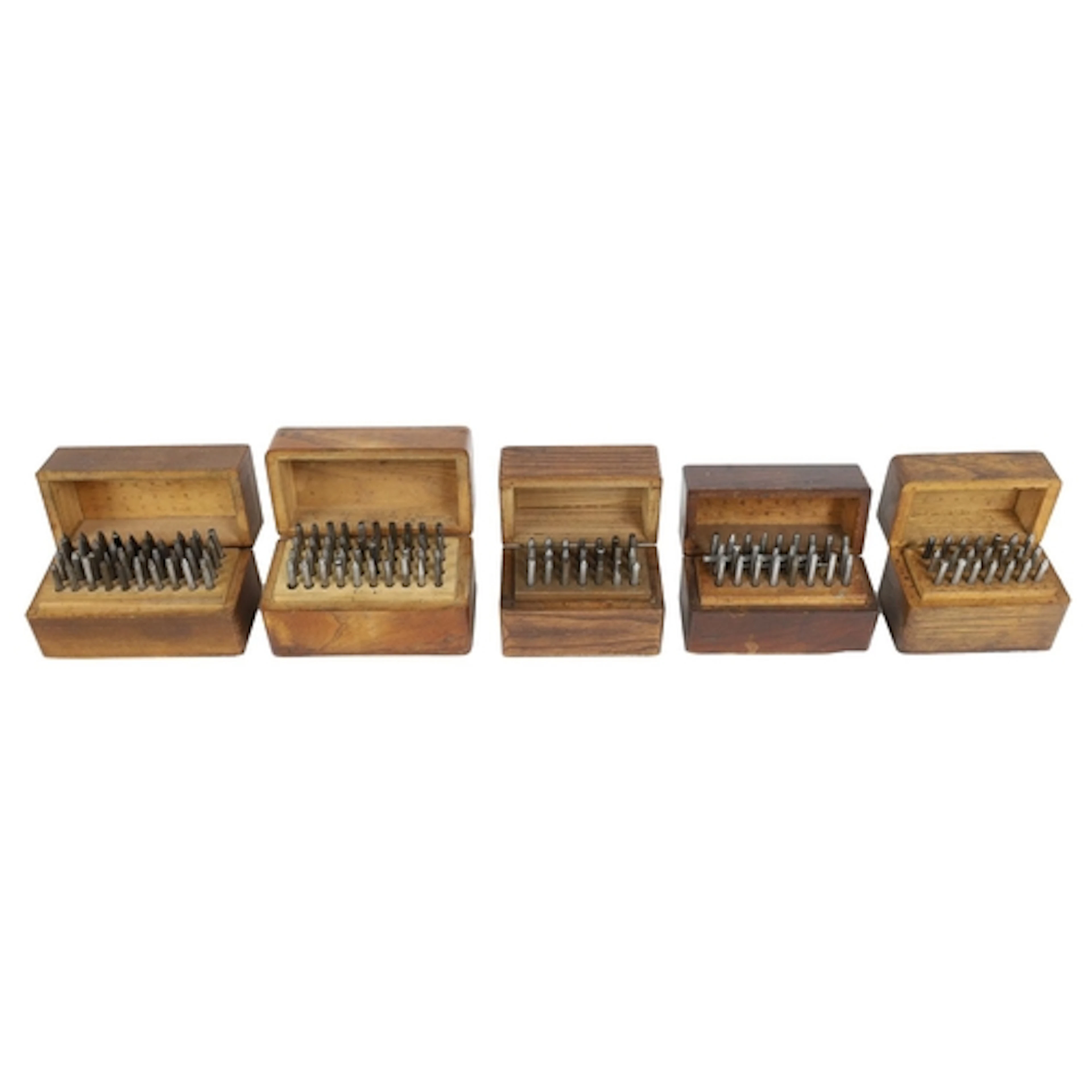 Five sets of watchmakers punches within wooden boxes...