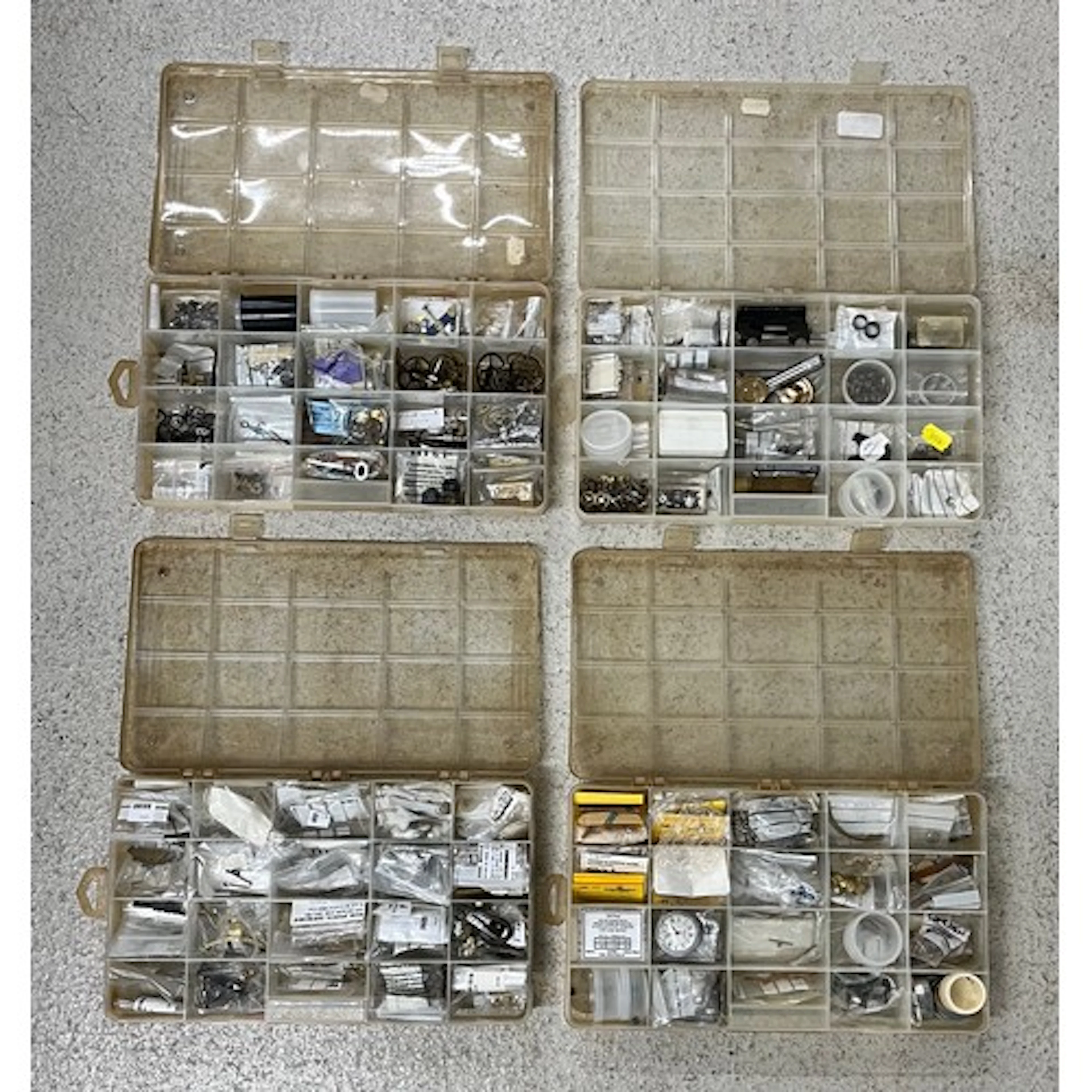 Four compartmental storage boxes containing clock and marine...