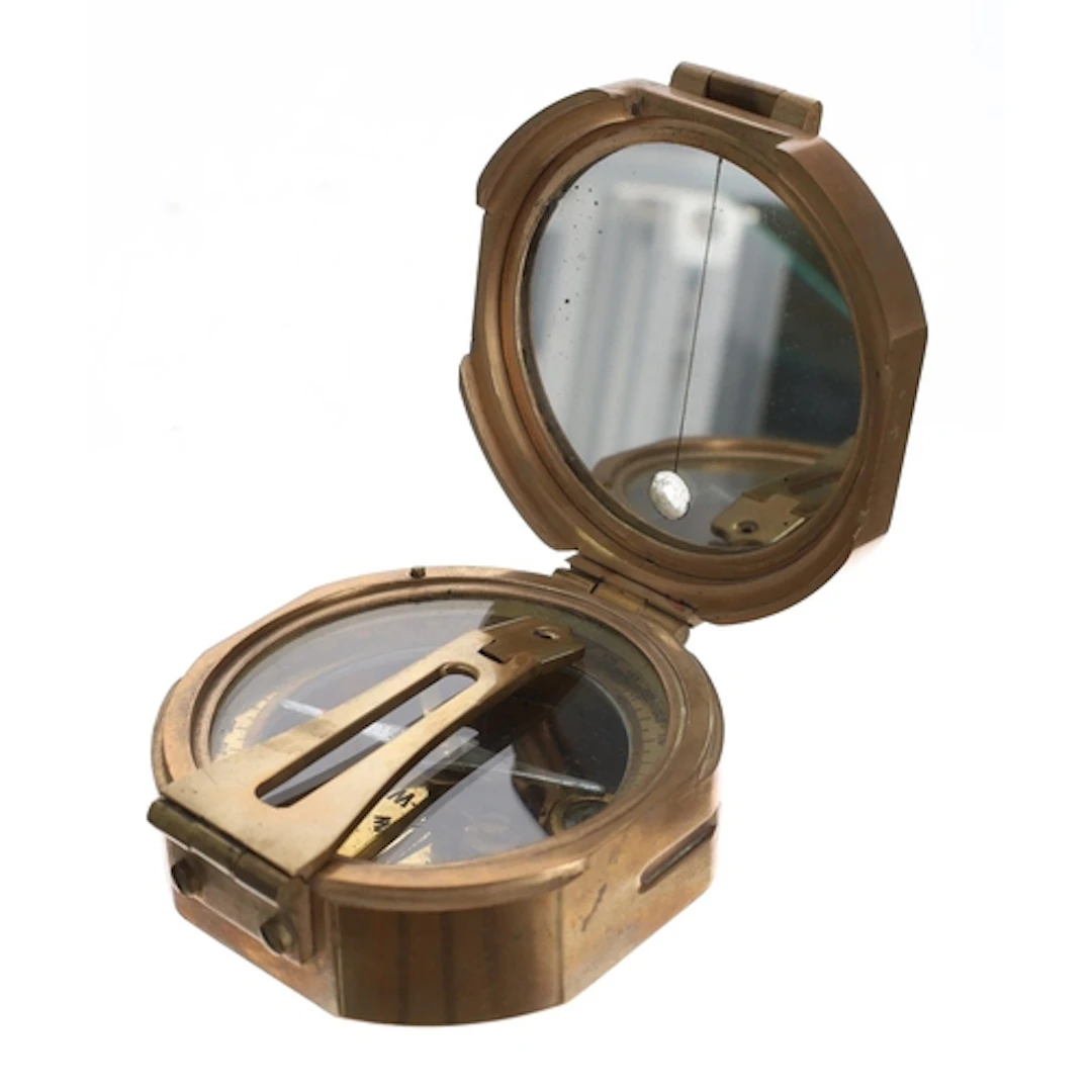 Pocket barometer beneath a Perspex dome, with 1.75" circular...