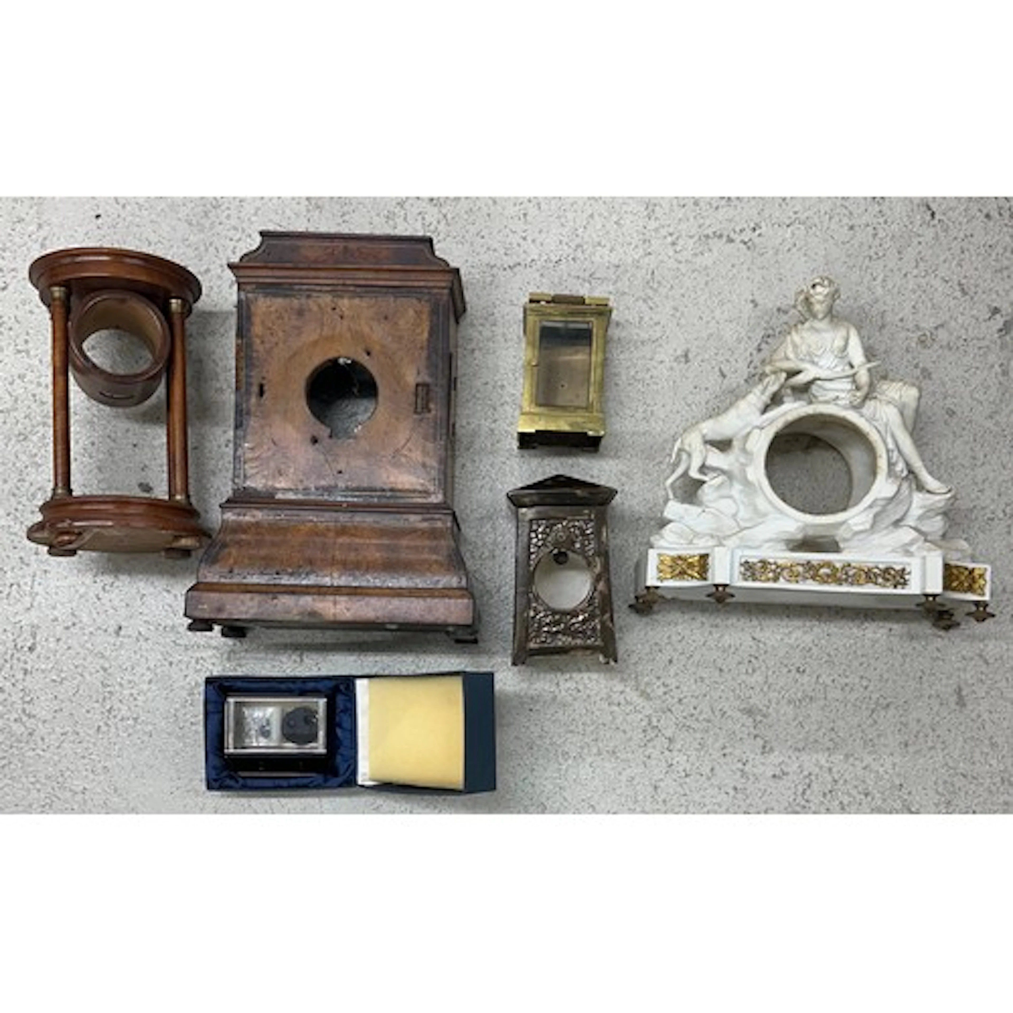Late 18th century French bisque clock case, surmounted by th...