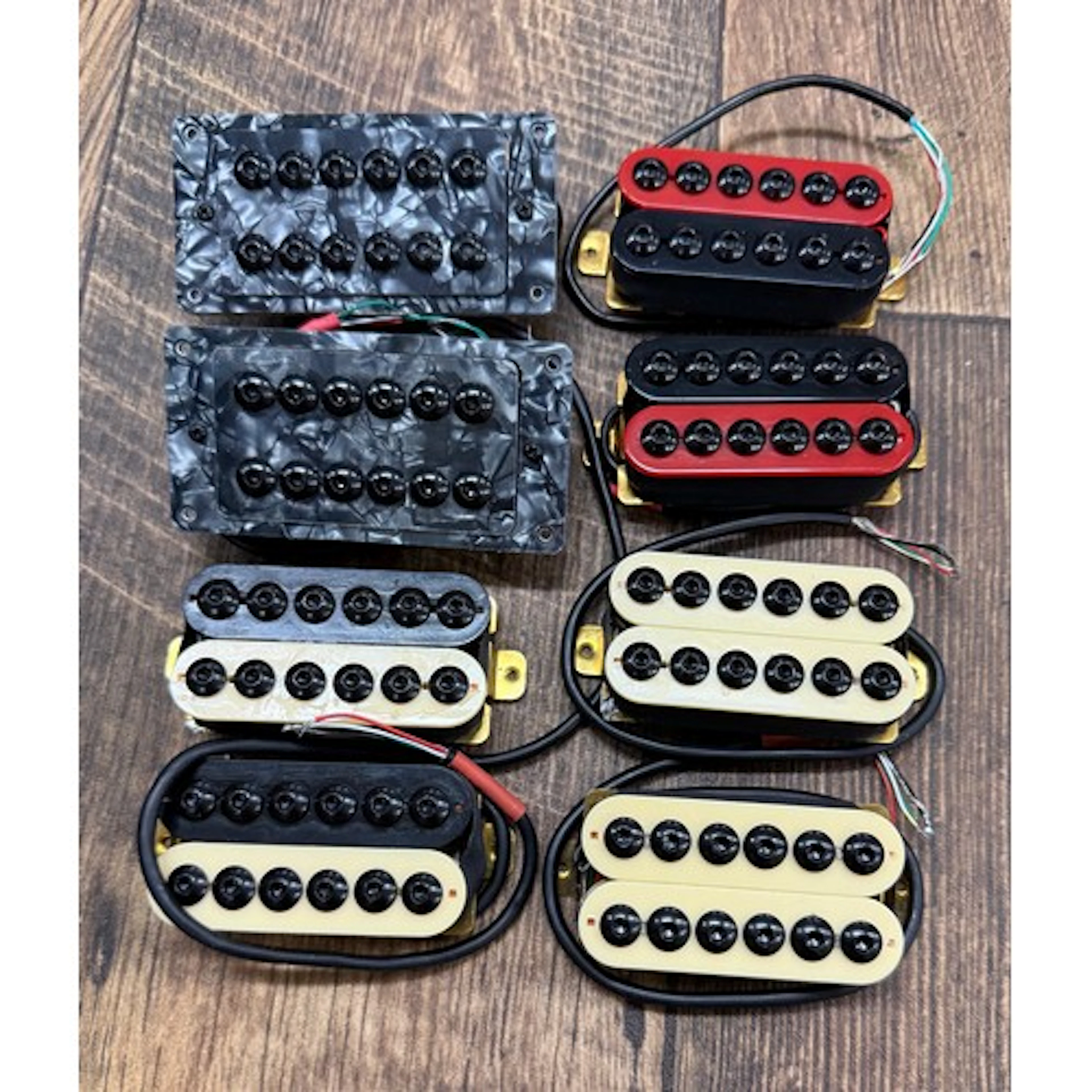 Four pairs of Invader style humbucker guitar pickups...