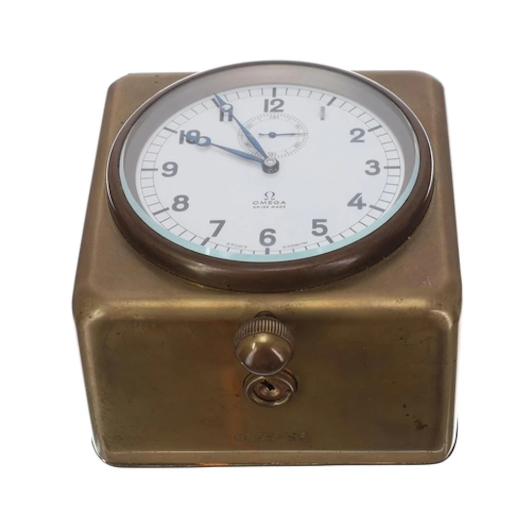 Omega brass cased car clock, retailed by Story Barrow, movem...