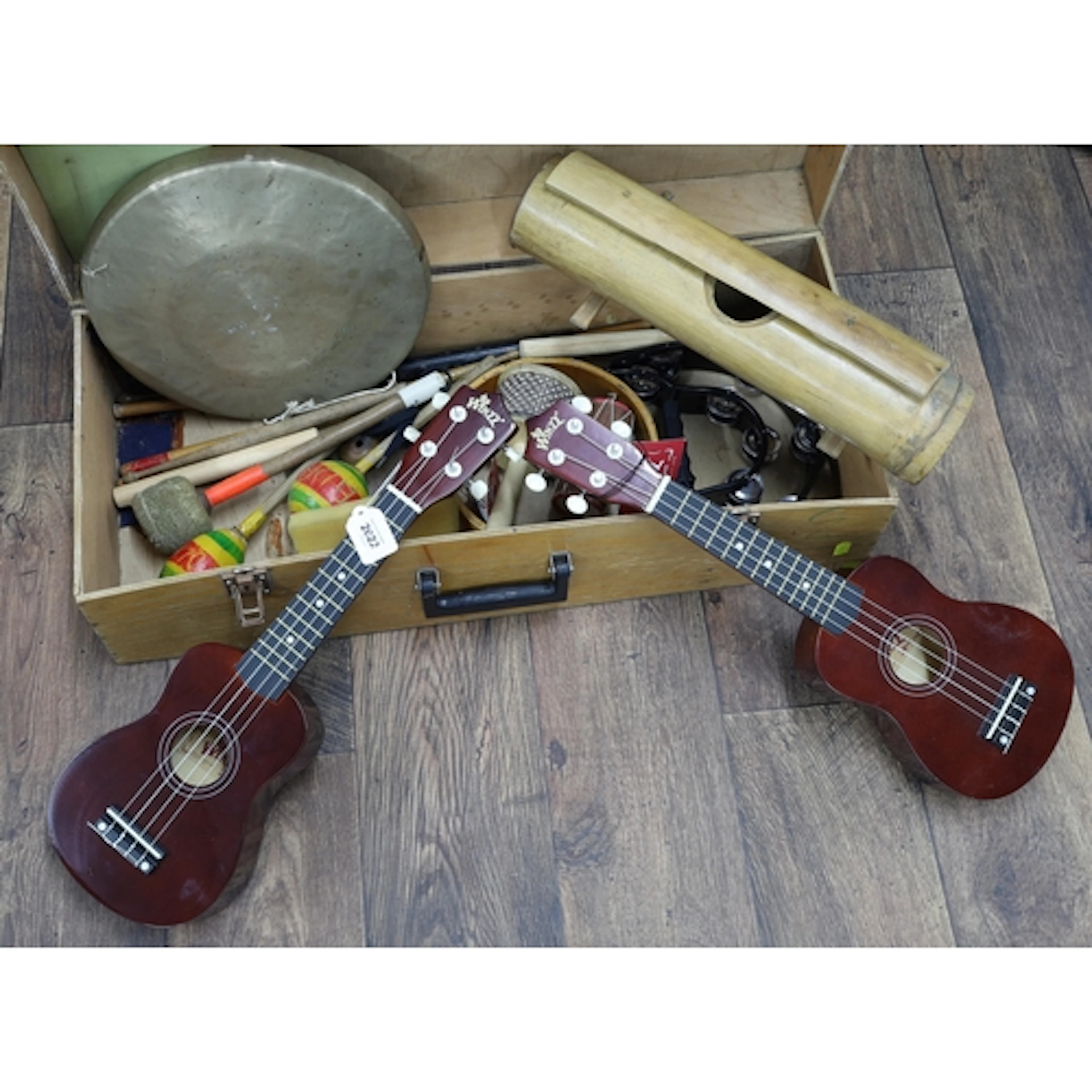 Two Winzz Model AU01L-BR ukuleles; together with a group of ...