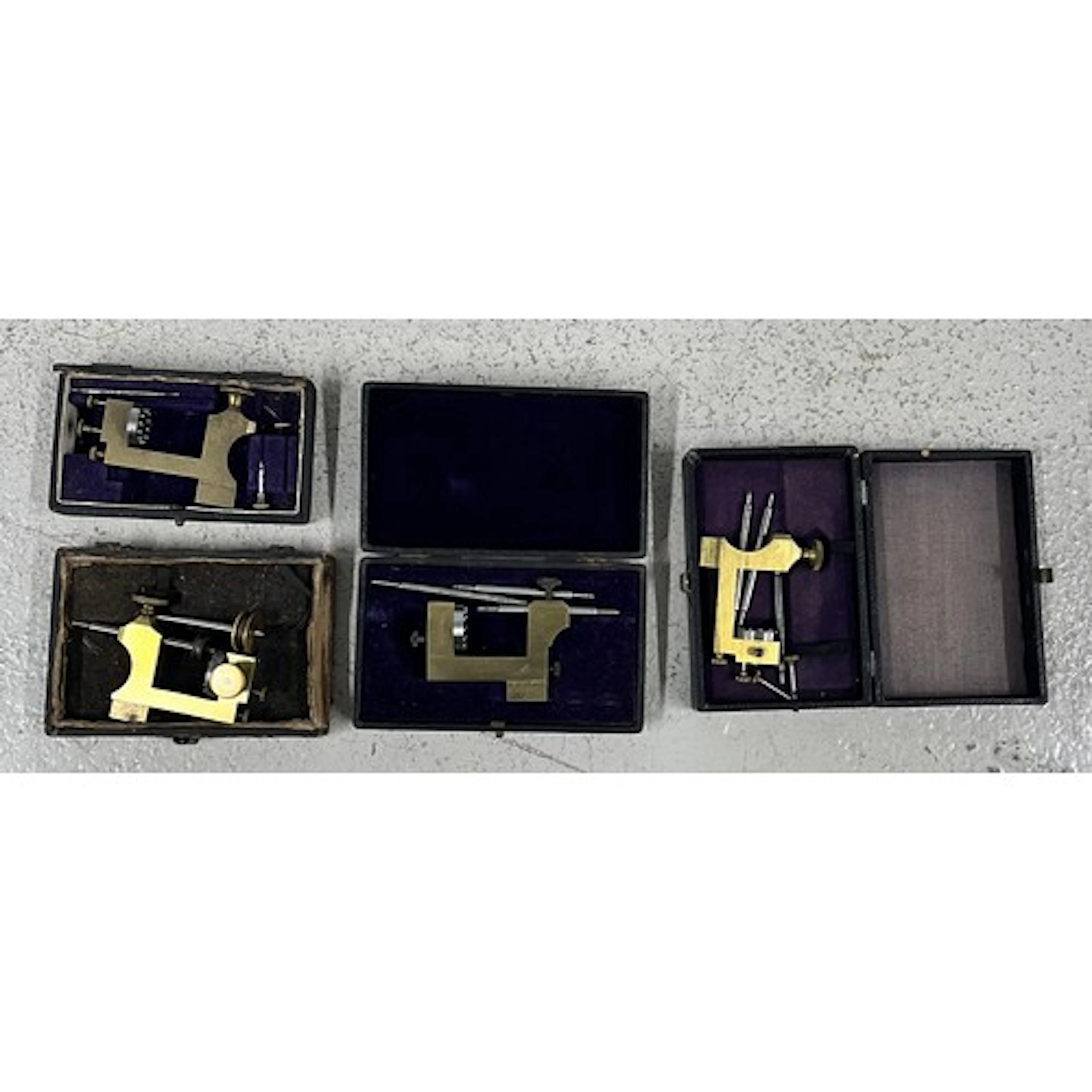 Four cased brass and steel watchmakers pivot tools (4)...