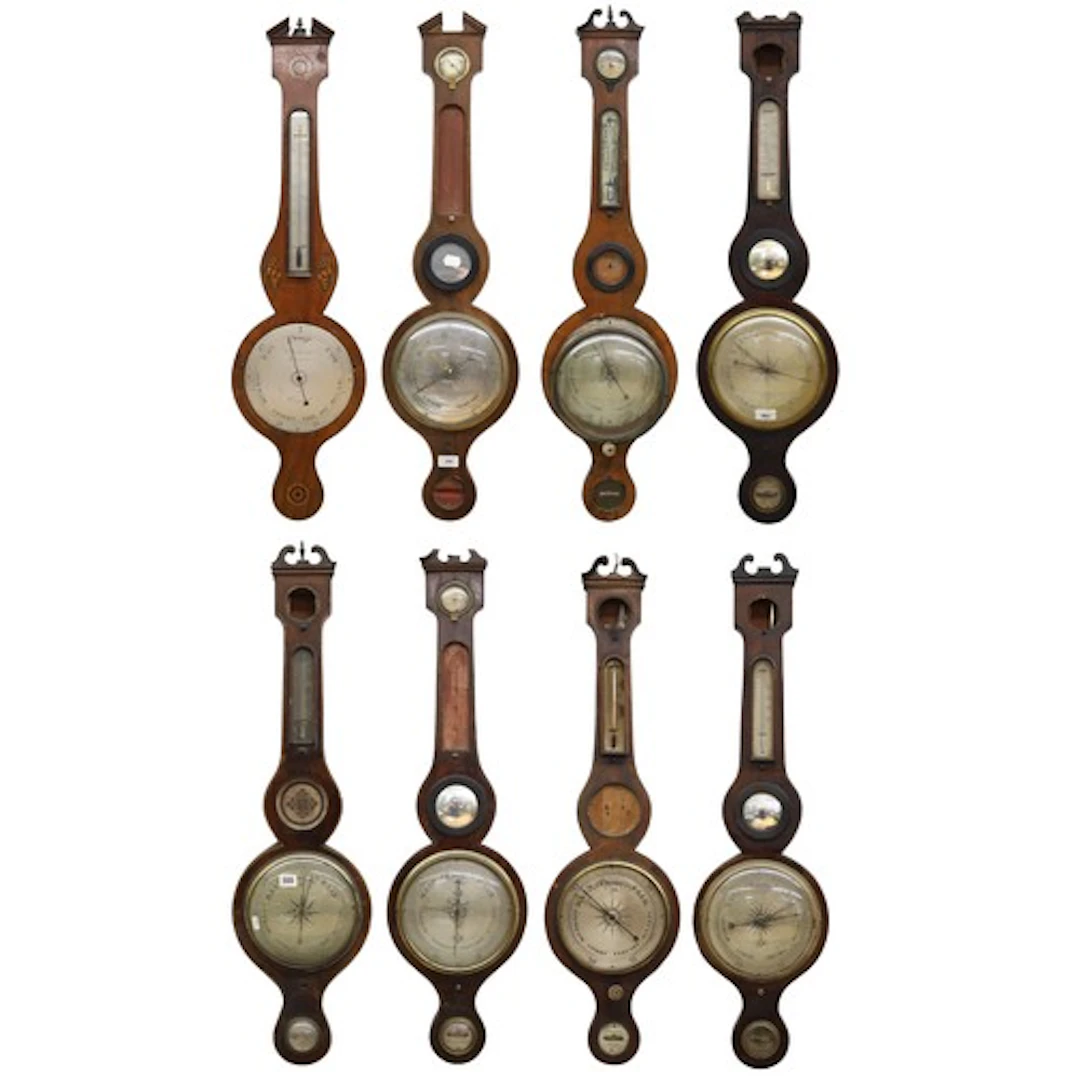 Group of eight 19th century inlaid mahogany wheel barometers...
