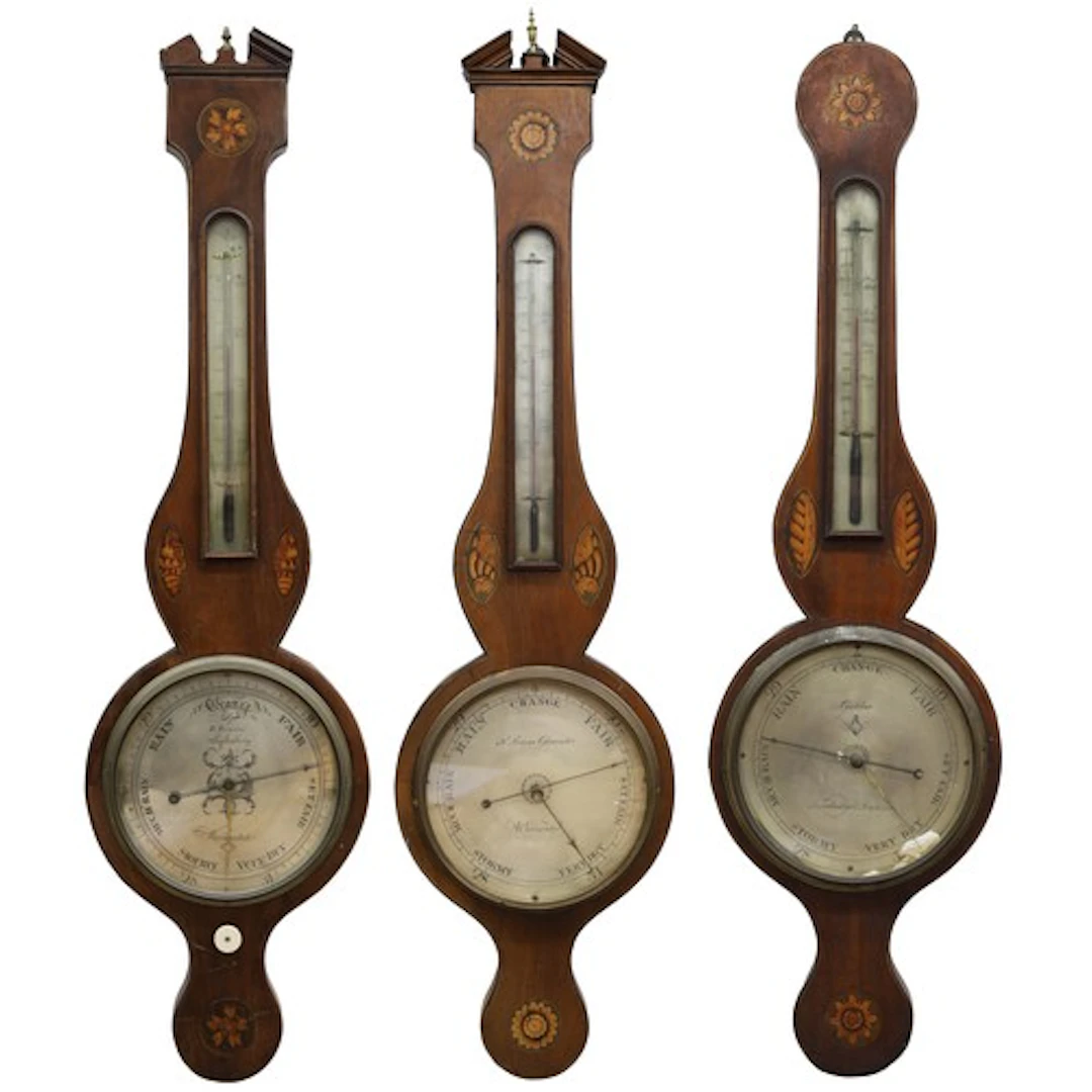 Group of three 19th century shell inlaid mahogany wheel baro...