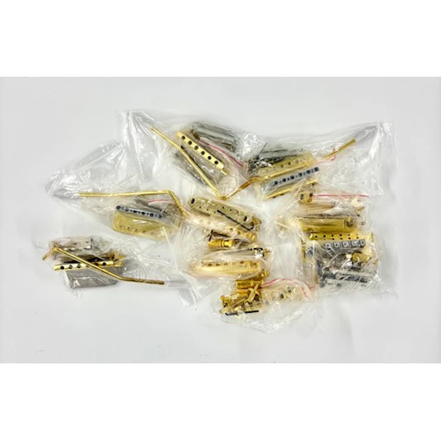 A selection of gold plated guitar hardware, to include a lic...