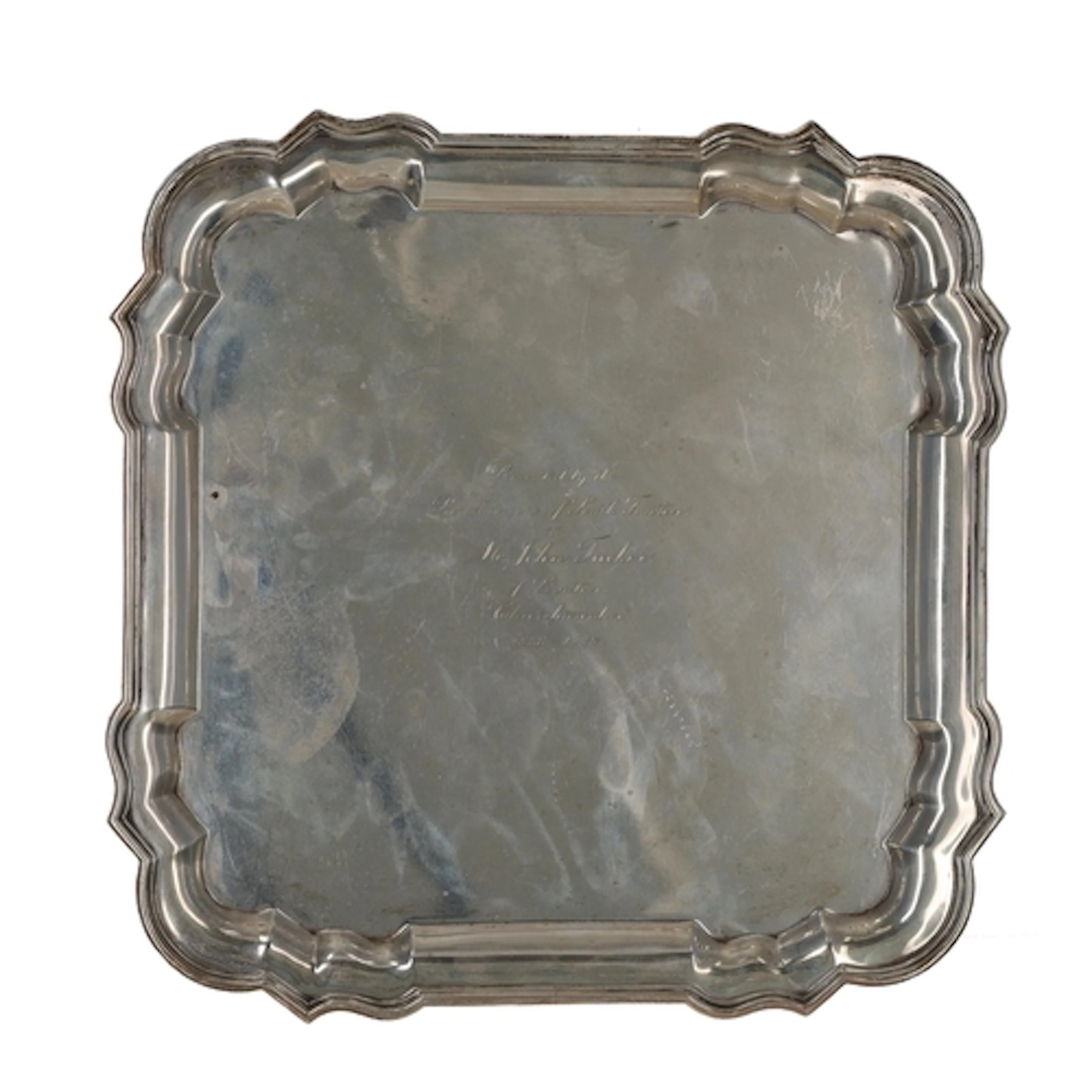 George V silver salver, of shaped square outline with four p...