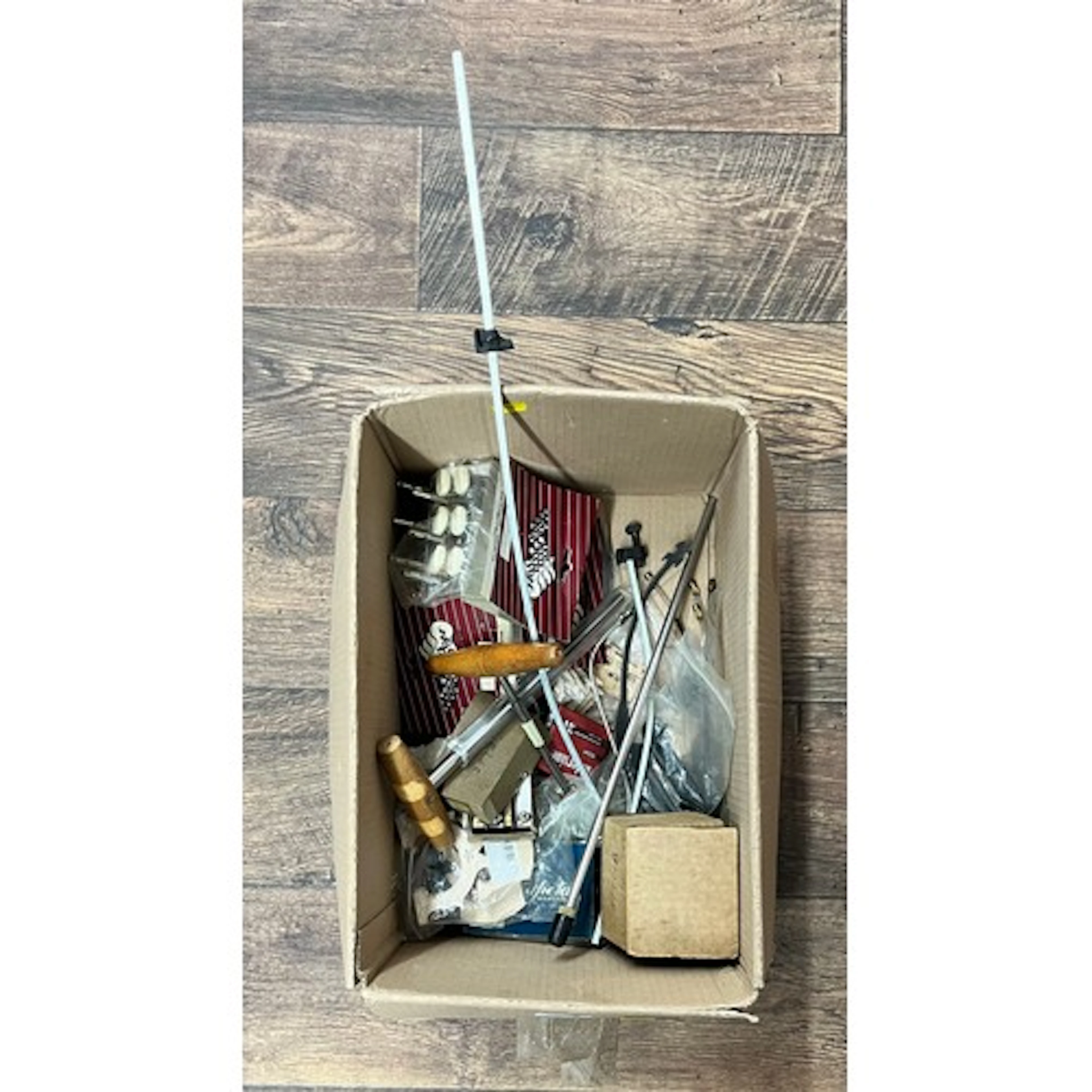 Box of various stringed instrument fittings and tools includ...