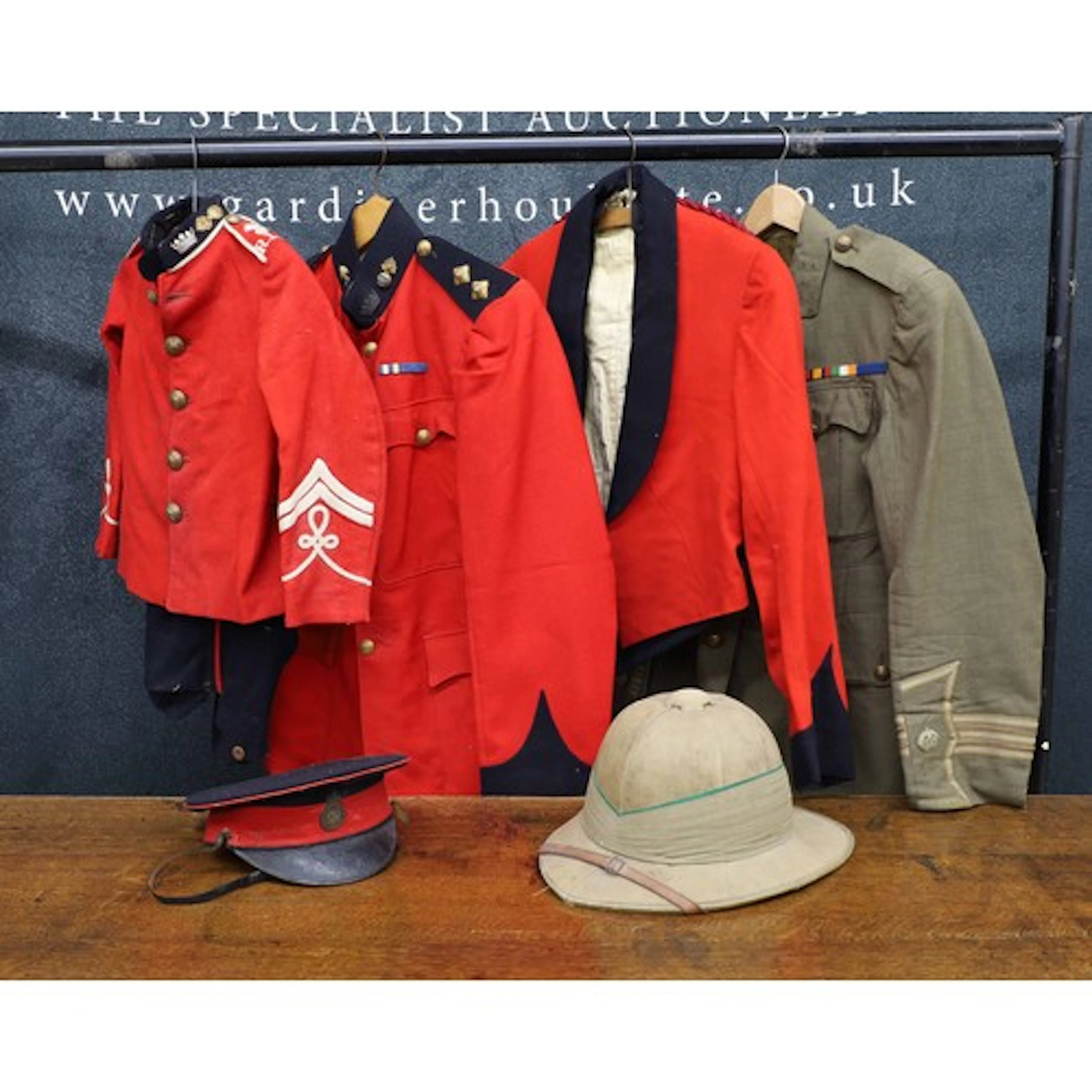 Group of Vintage military uniforms, comprising two red dress...