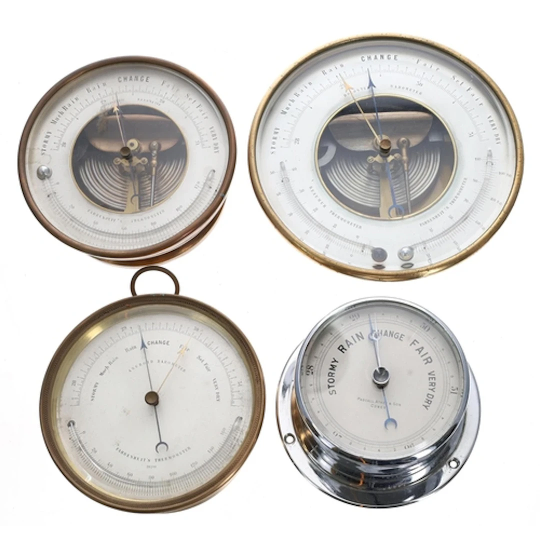 Three brass drum cased barometers/thermometers, the largest ...