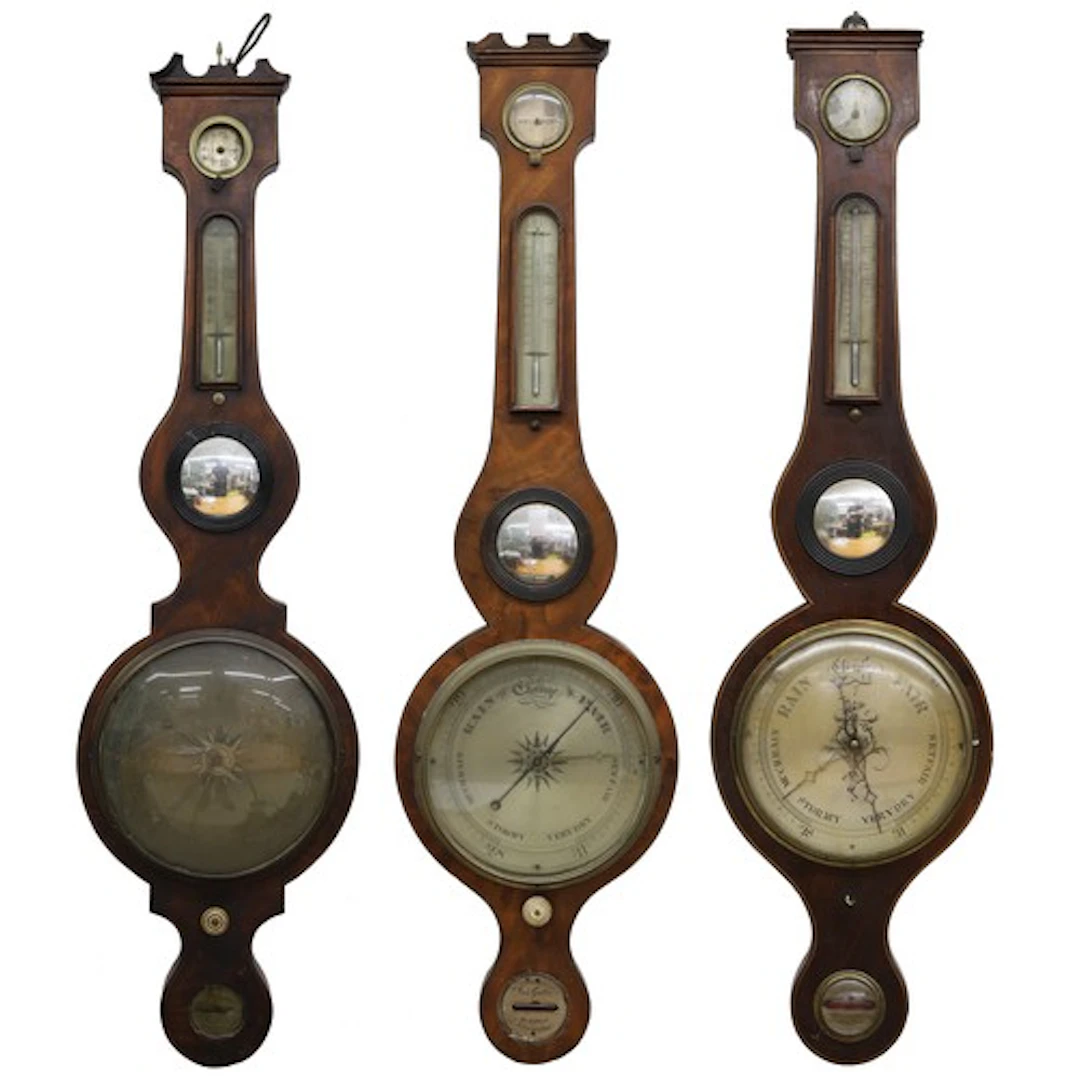 Group of three 19th century inlaid mahogany wheel barometers...