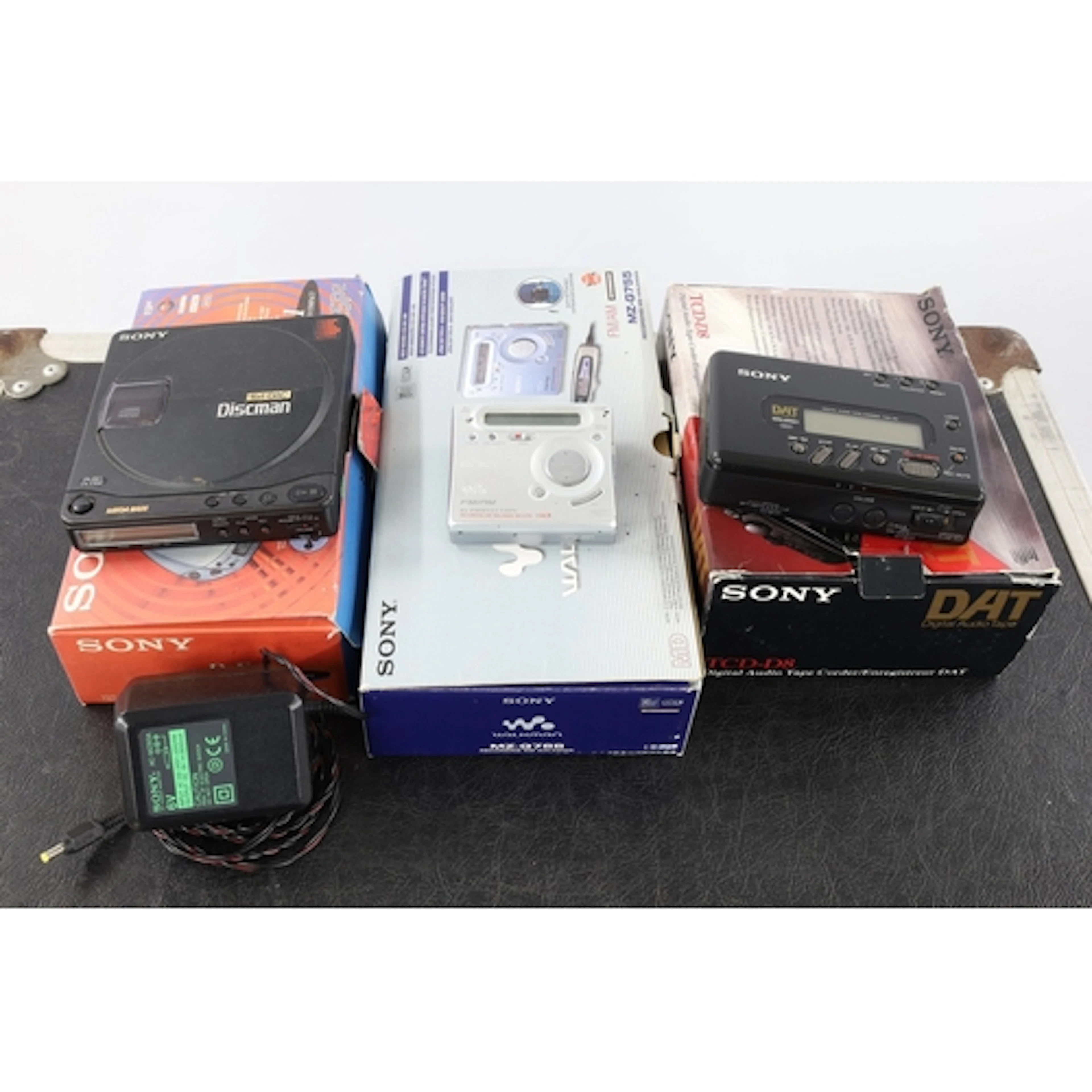 Three portable music players to include a Sony Walkman MG-G7...