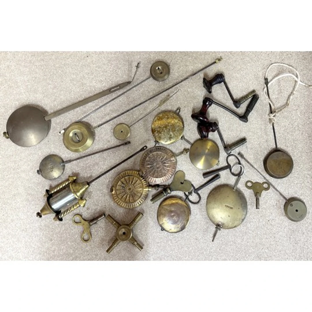 Selection of clock pendulums, winding keys etc...