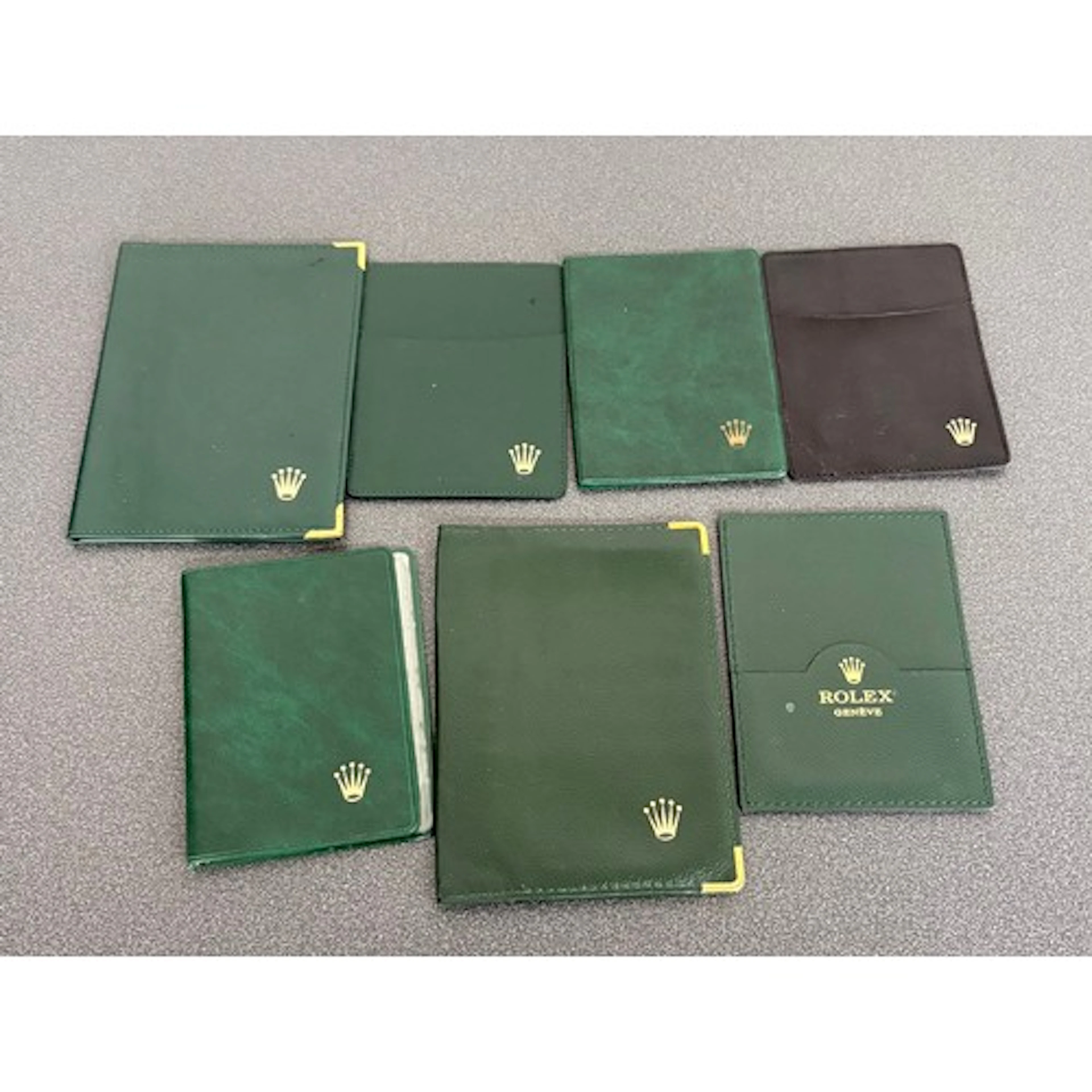 Rolex - six green and one black assorted card wallets (7)...