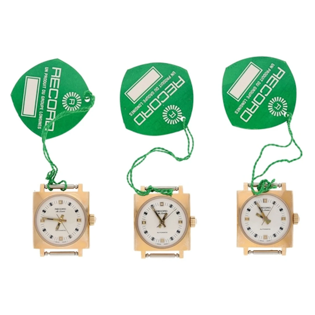 Three Record De Luxe automatic square cased gold plated ladi...