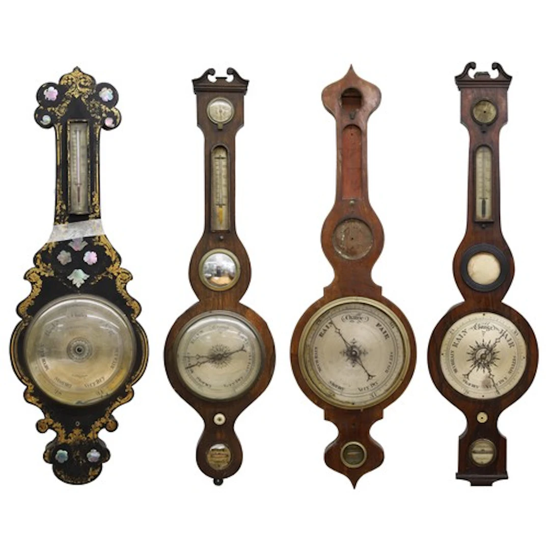 Four Barometers to include a 19th century inlaid mahogany on...
