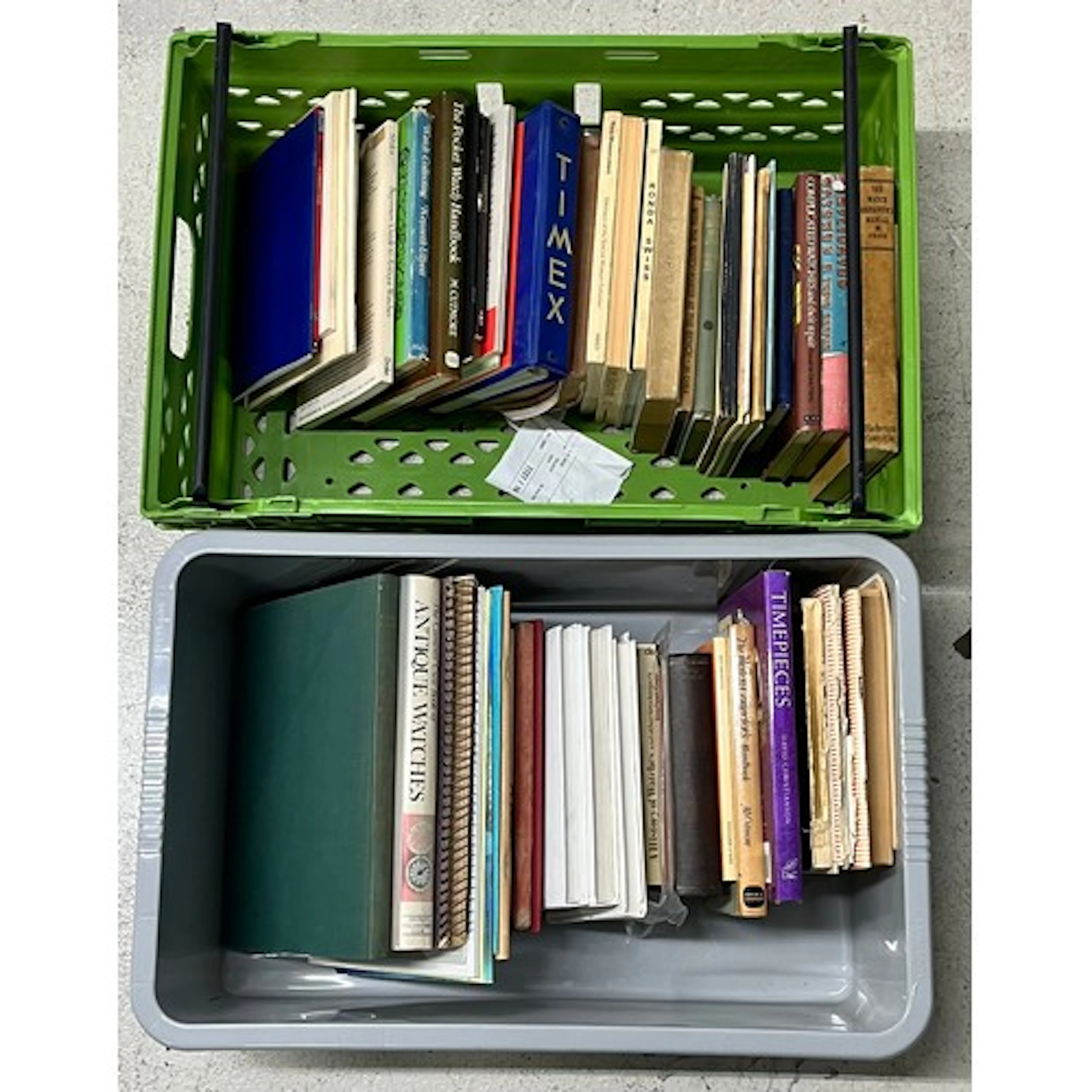 Two boxes containing a quantity of various watch reference b...