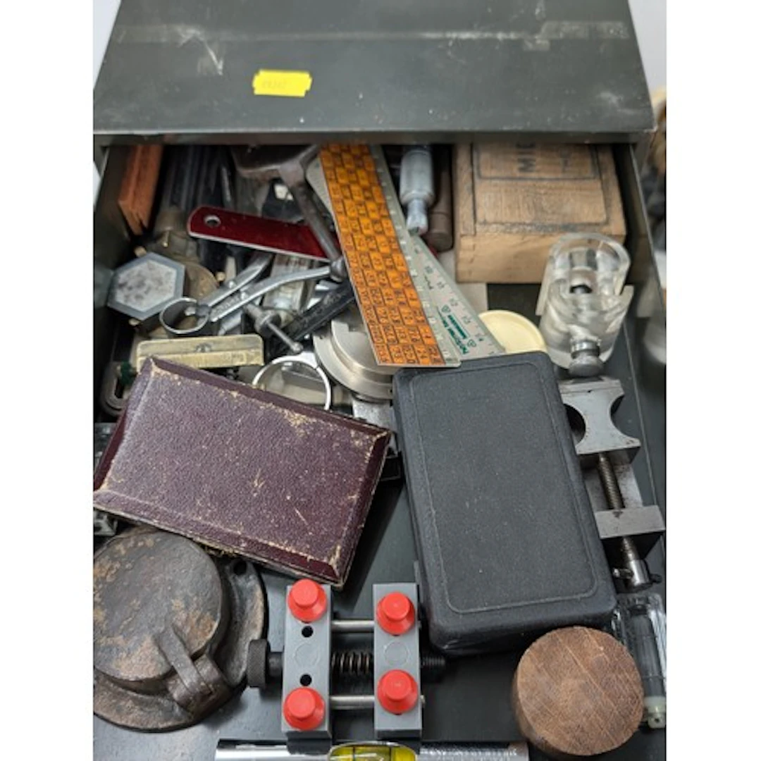 Metal worktop chest of drawers containing assorted precision...