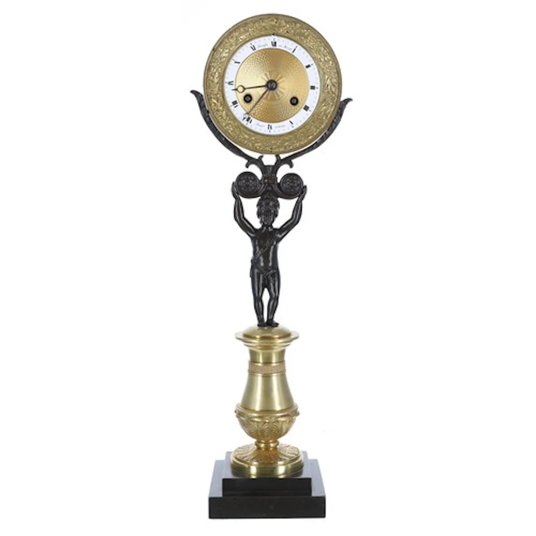 French Empire bronze and ormolu figural mantel clock, the 3....