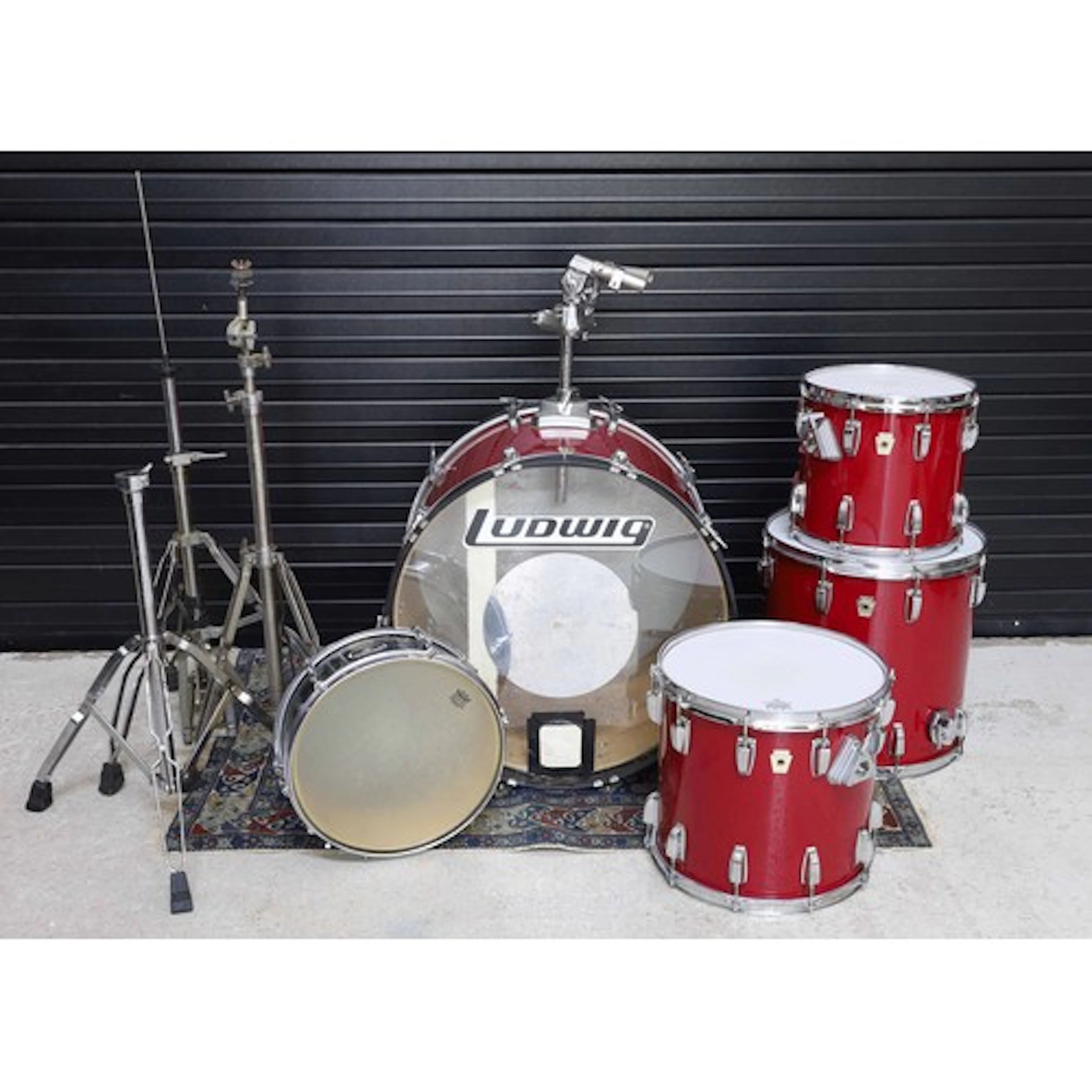 Ludwig four piece drum kit, red finish; kick drum, 16" floor...