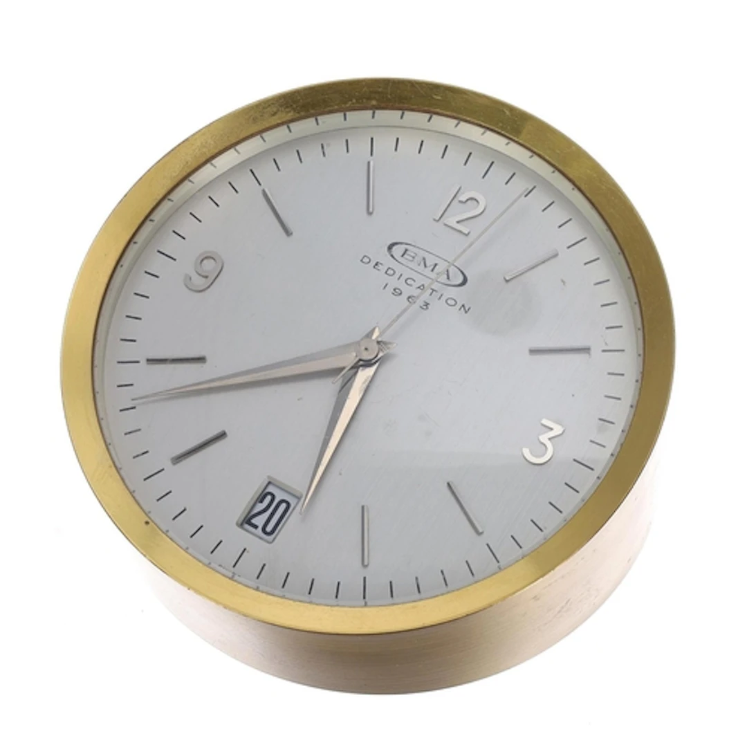 Swiss electric brass desk timepiece, the silvered dial inscr...
