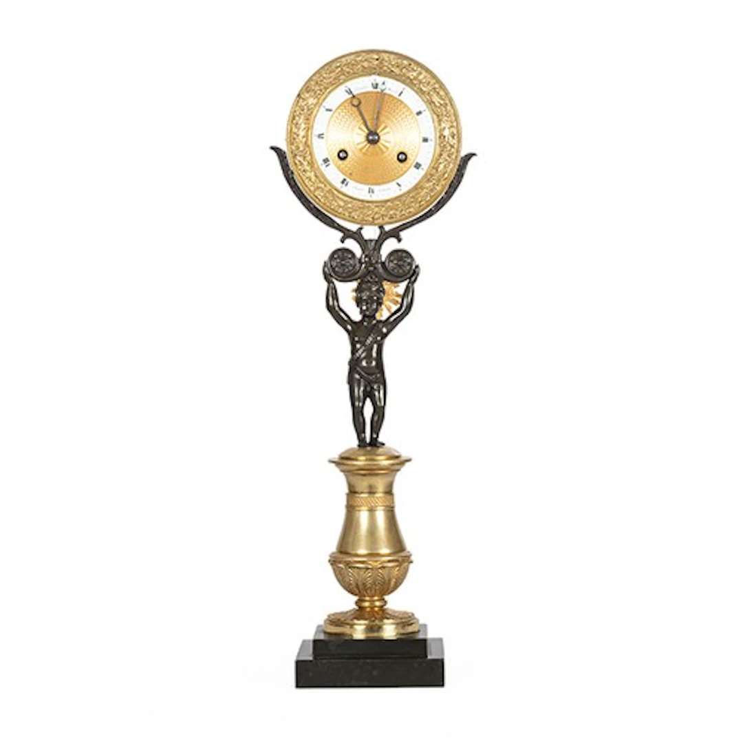 French Empire bronze and ormolu figural mantel clock, the 3....