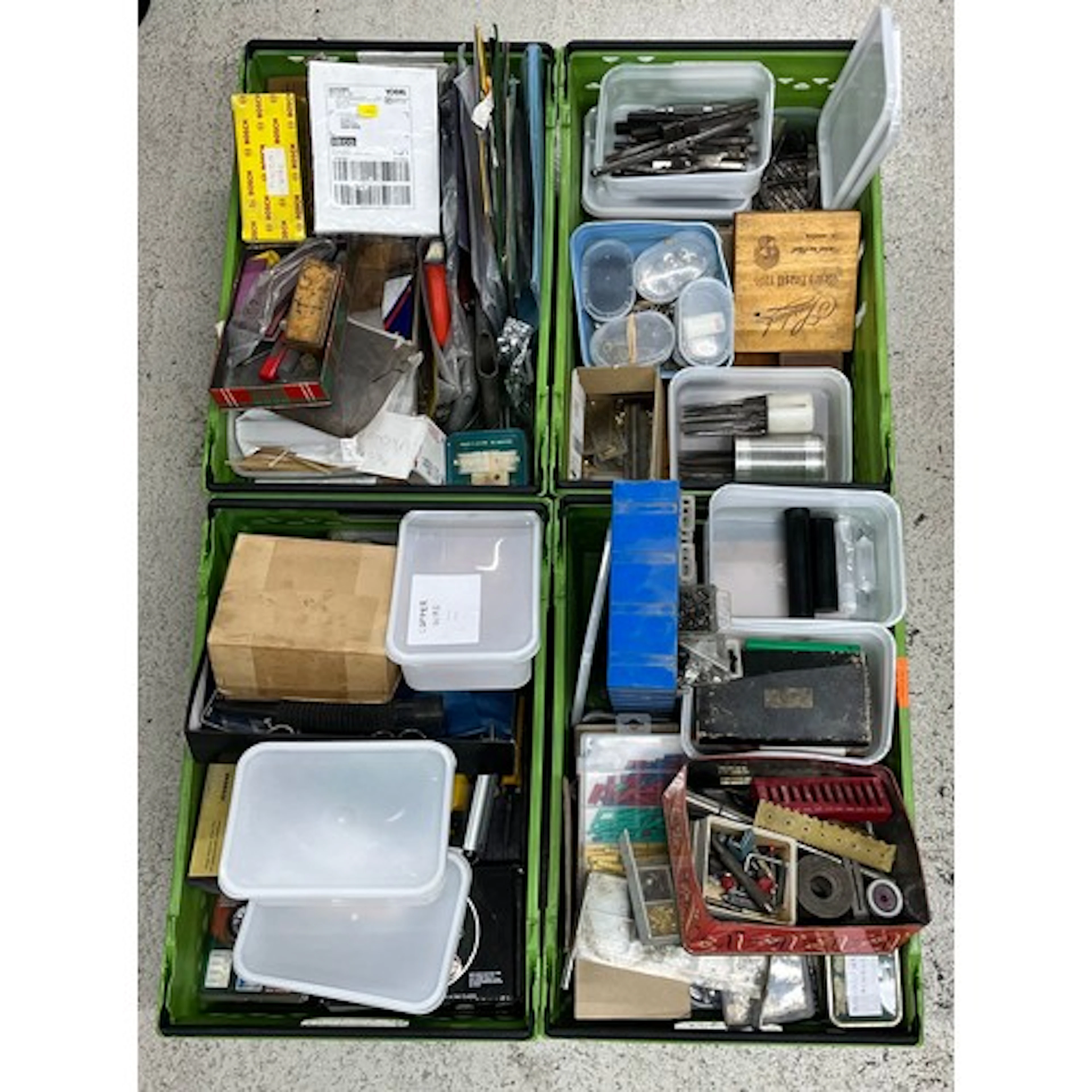Four crates containing a quantity of assorted tools and hard...