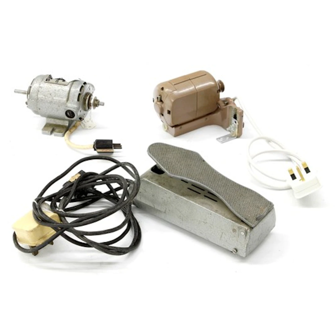 Two lathe motors, one with matching foot pedal, in cardboard...