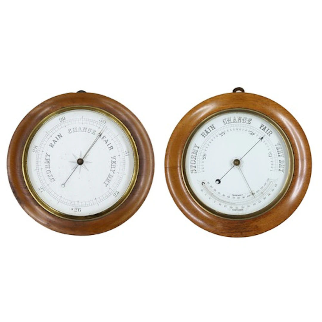 Circular oak wall barometer/thermometer with a white enamell...