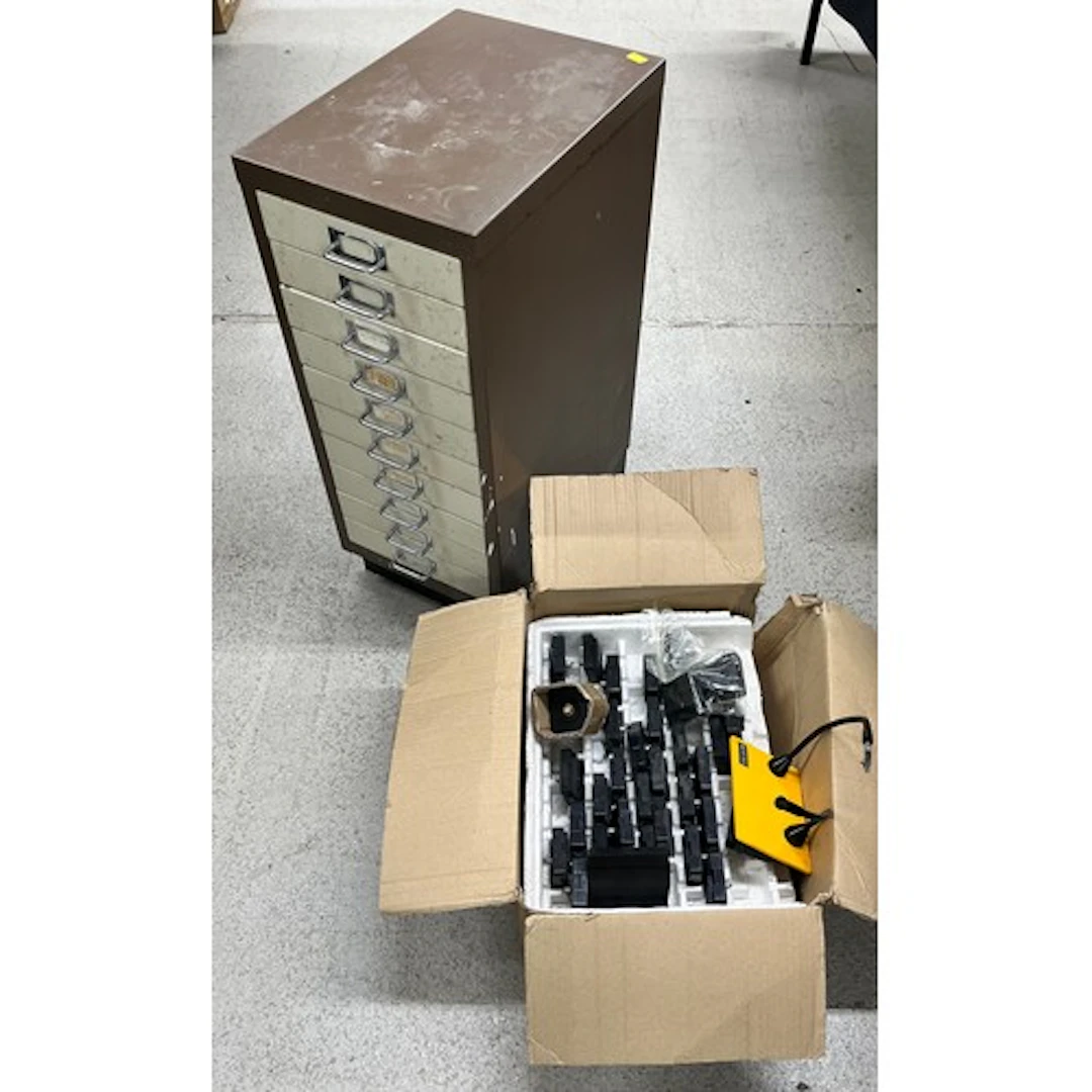 Ten drawer metal storage cabinet containing a quantity of cl...