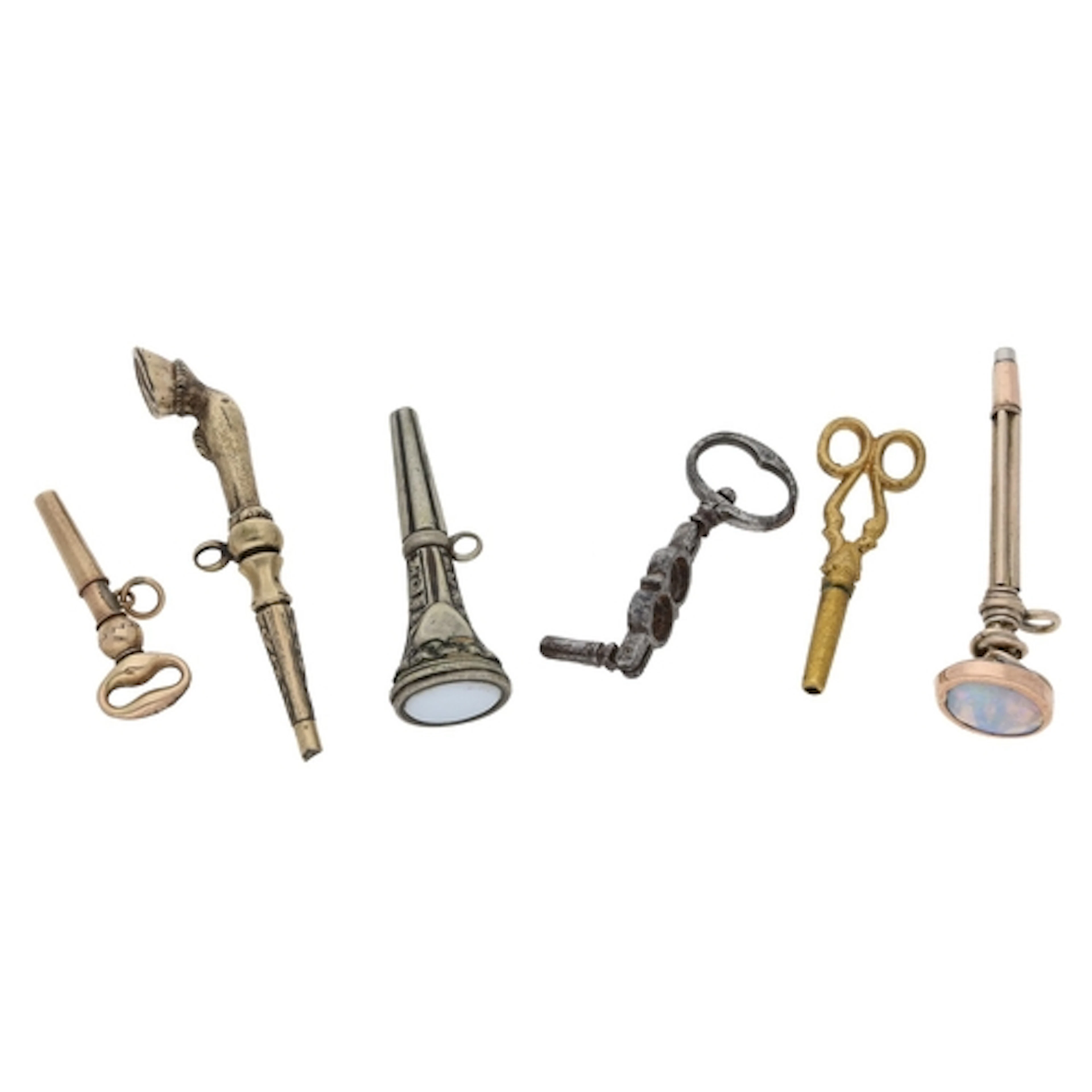 Six interesting pocket watch keys to include a gilt metal ke...
