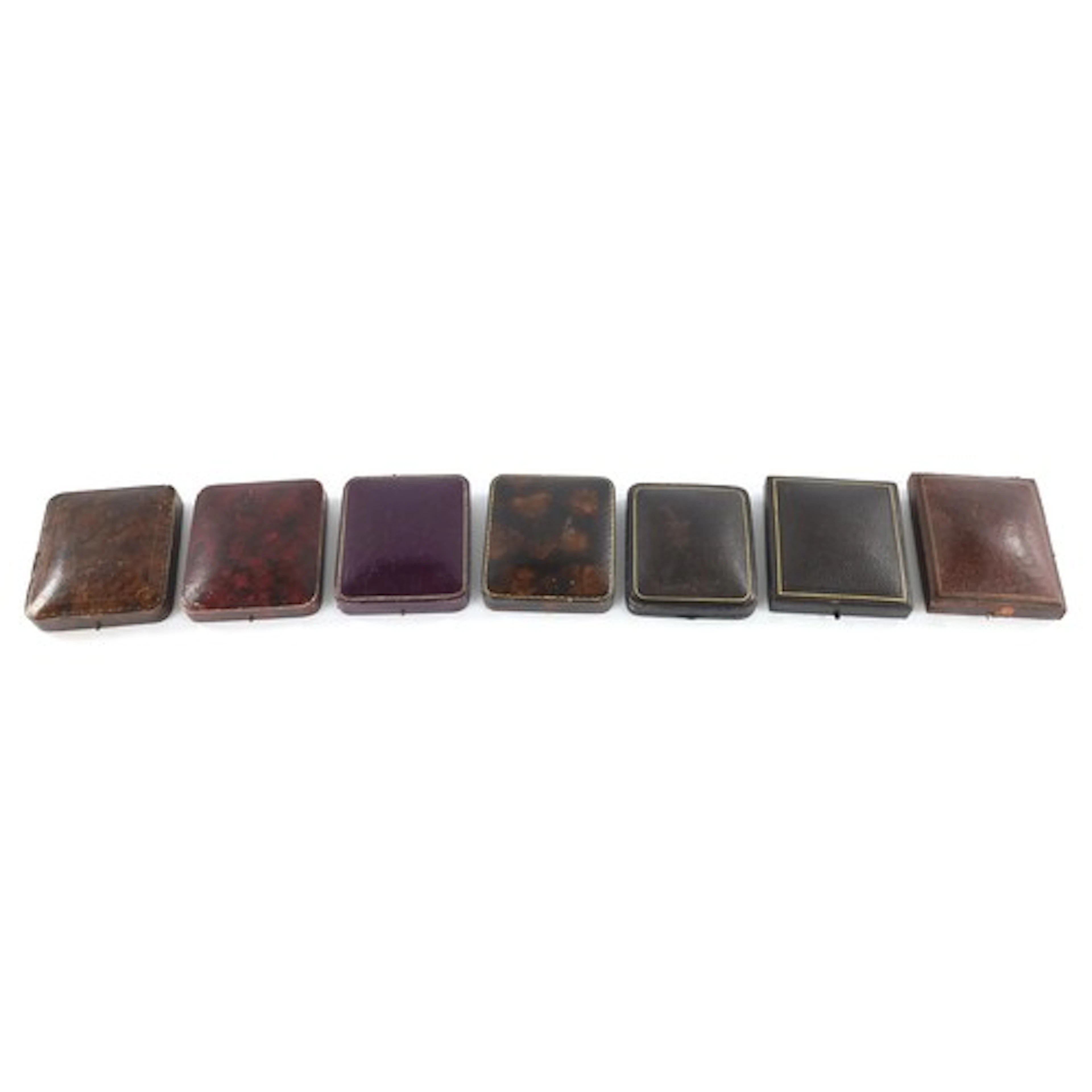 Seven leather bound pocket watch display cases, to include J...