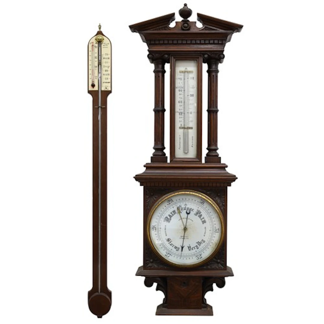 Carved oak aneroid barometer, the ornate case with broken ar...